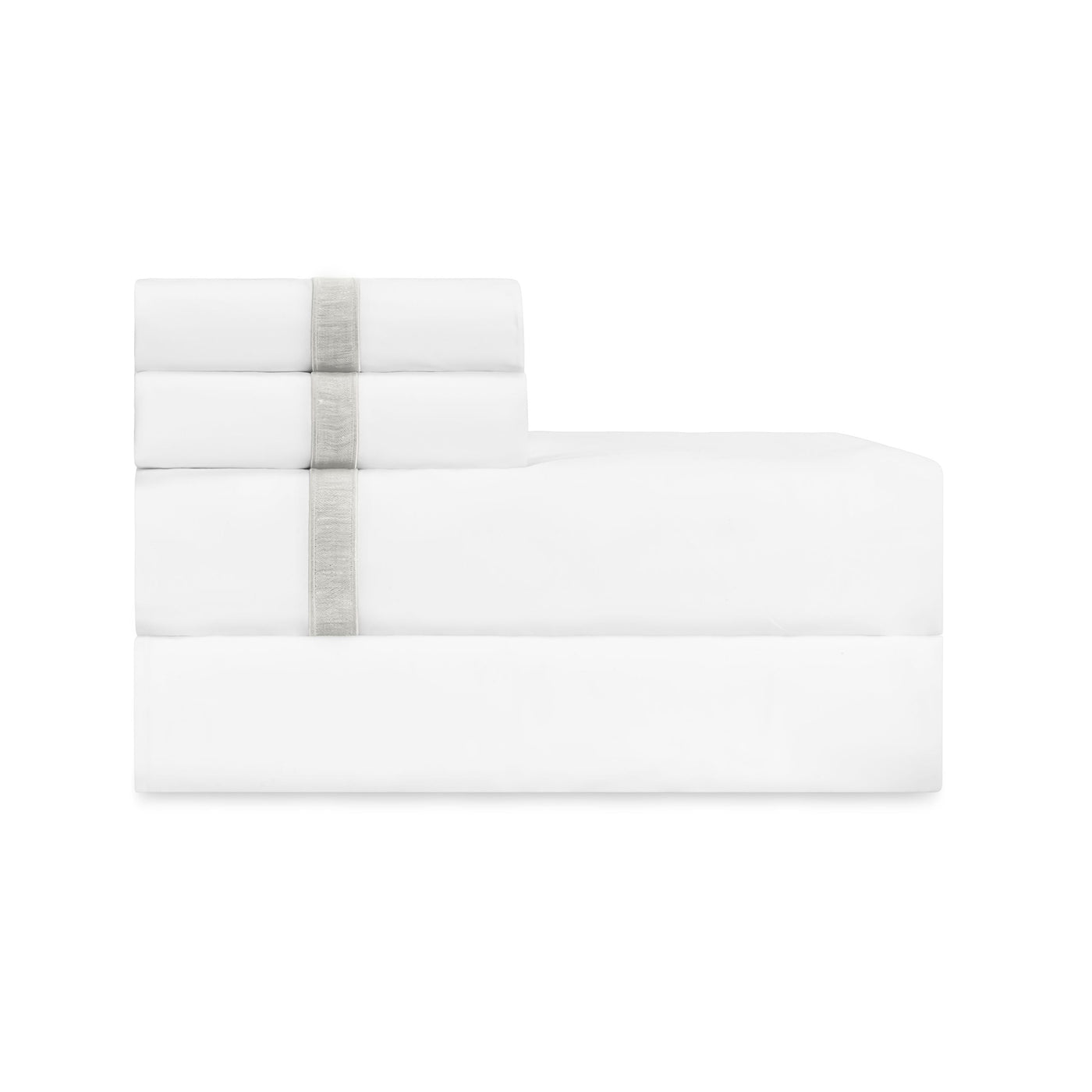 Close-up of folded white sheet set with silver ribbon trim accent.
