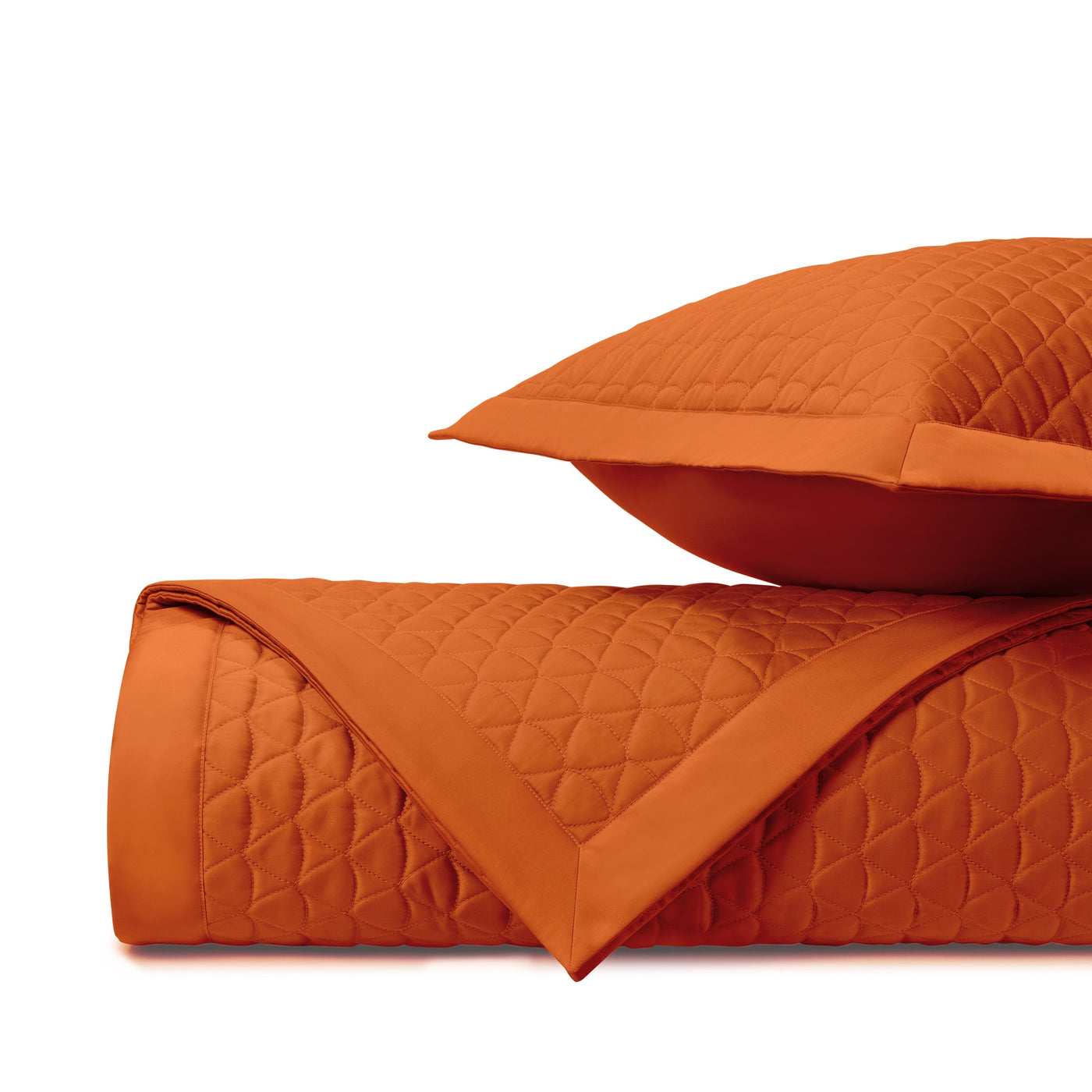 Clementine quilted texture and border detail on rolled coverlet with matching sham.