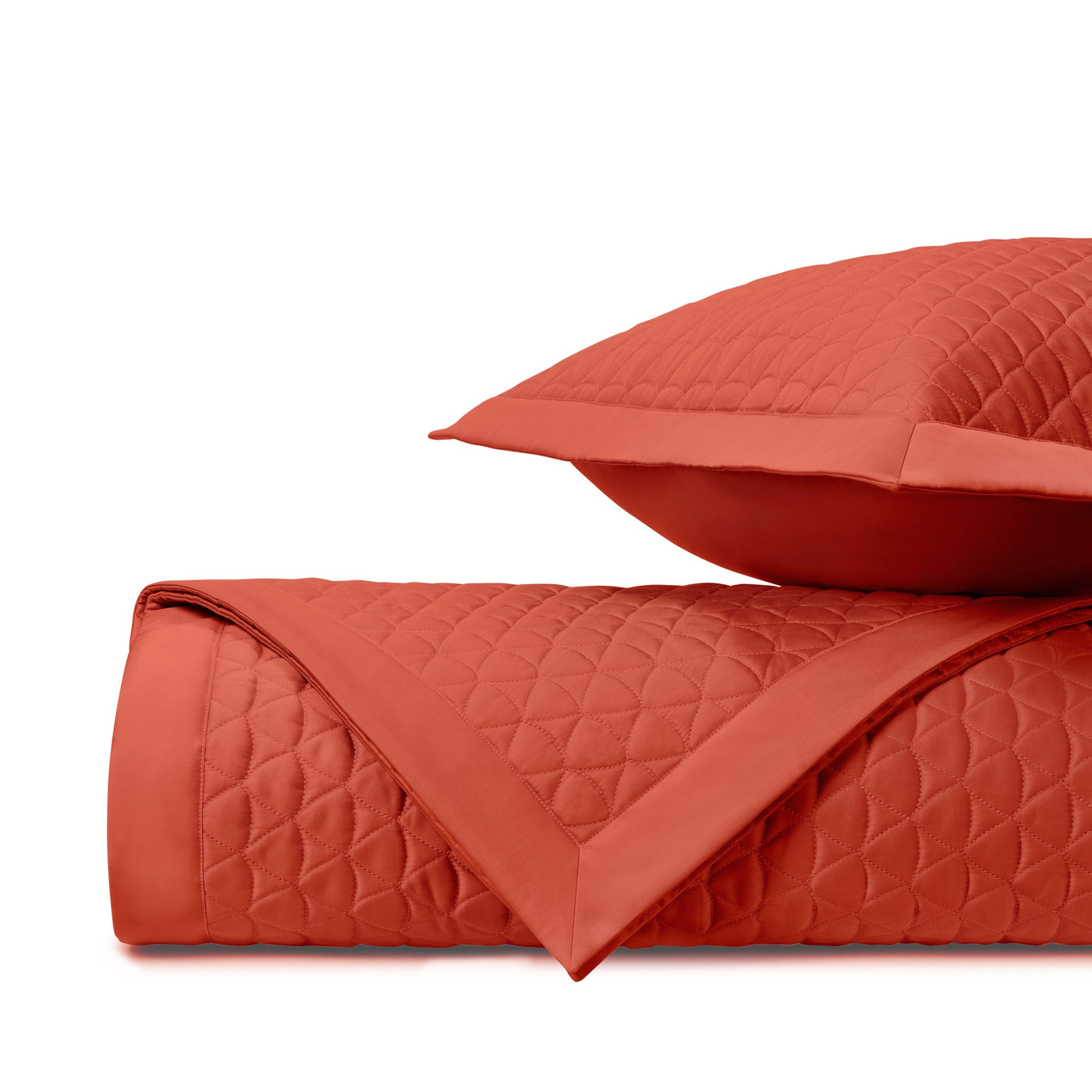 Close-up of Home Treasures Anastasia quilted coverlet in tomato red, diamond stitch pattern.