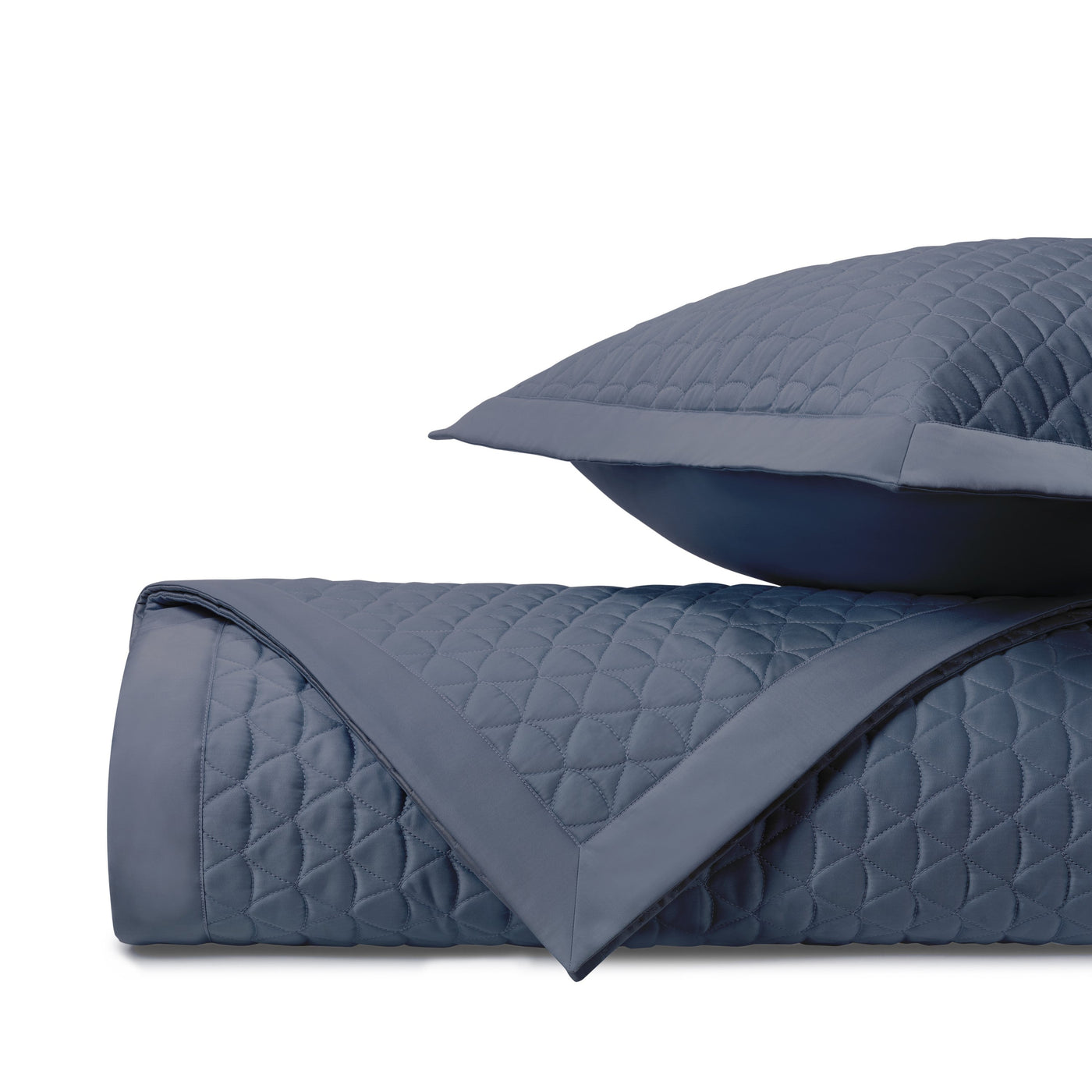Close-up of Home Treasures Anastasia quilted cotton in slate blue with diamond stitching.