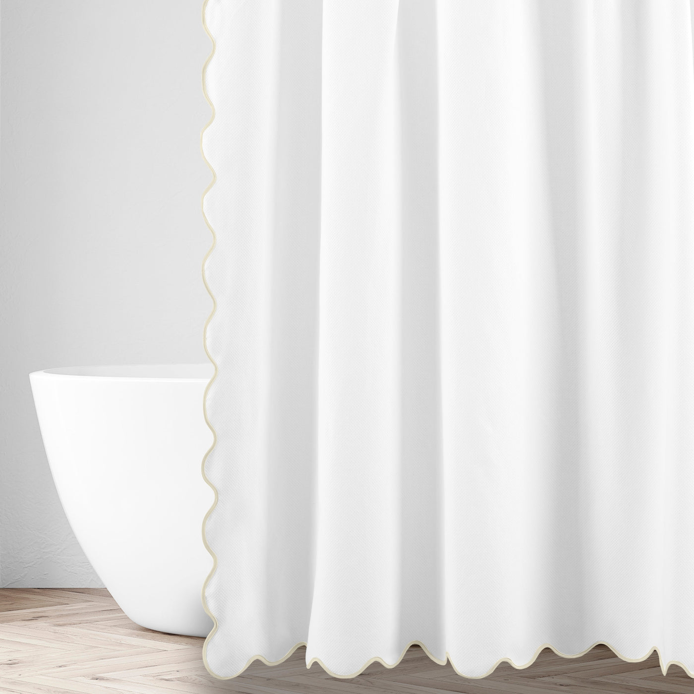 White shower curtain with champagne scalloped trim edge, styled in a bright bathroom setting.