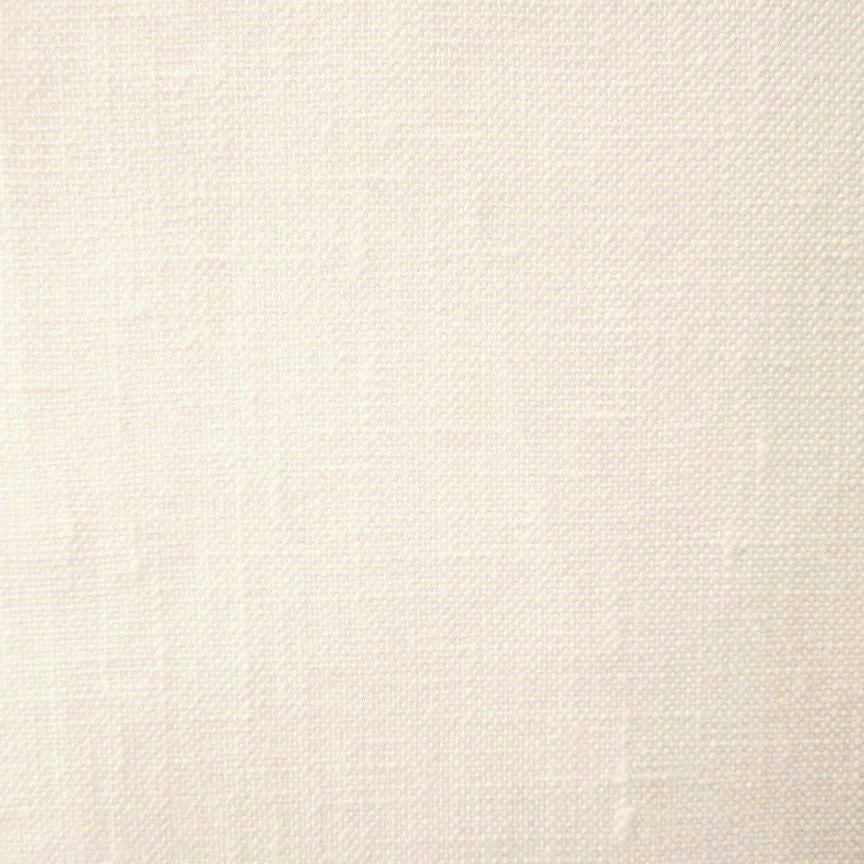 Close-up of ivory woven linen fabric showing open-weave texture and natural slub.