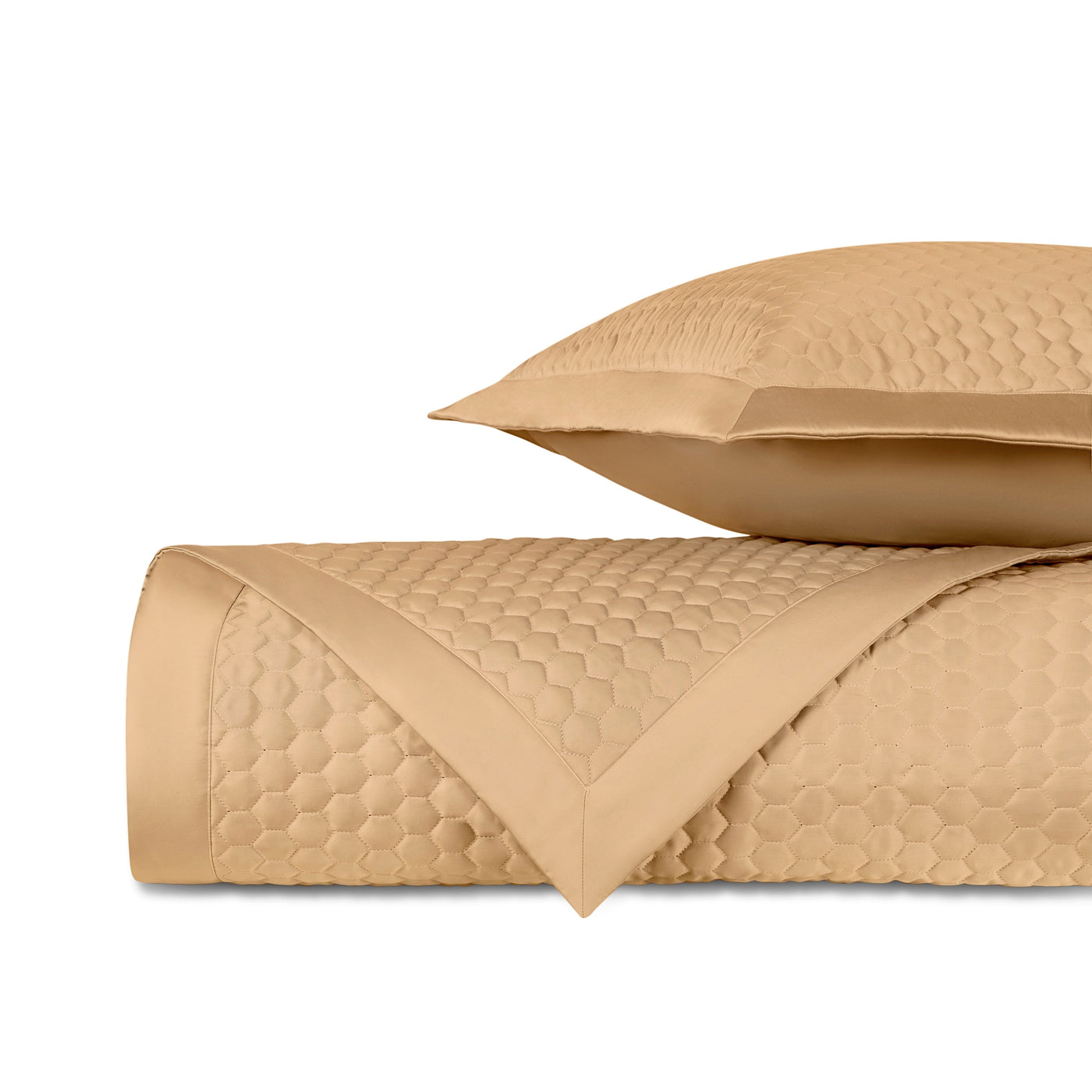 Honeycomb quilted texture detail on Home Treasures Apiary coverlet in caramel.