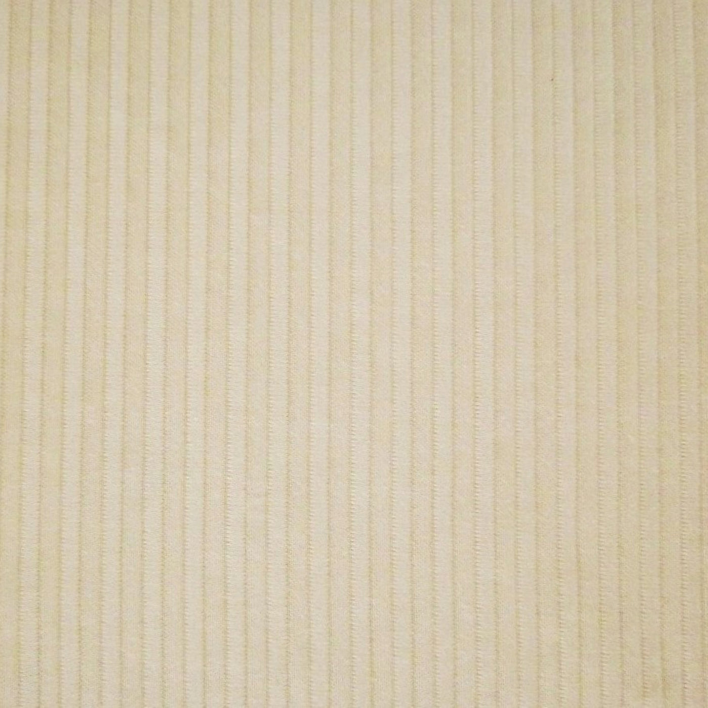 Close-up of ivory woven coverlet with tonal vertical stripe texture detail.
