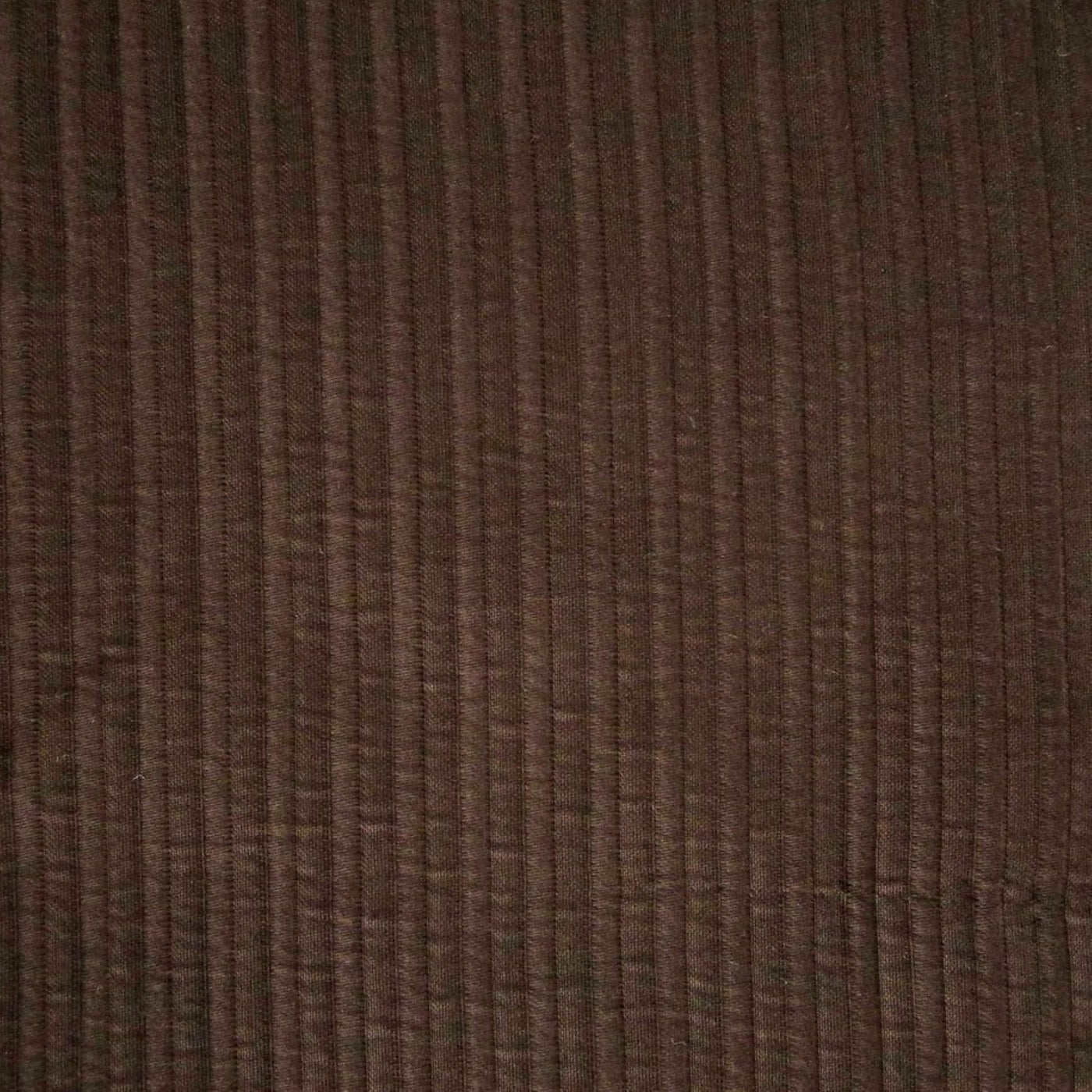 Close-up of Home Treasures Aristocrat coverlet showing chocolate ribbed cotton texture.