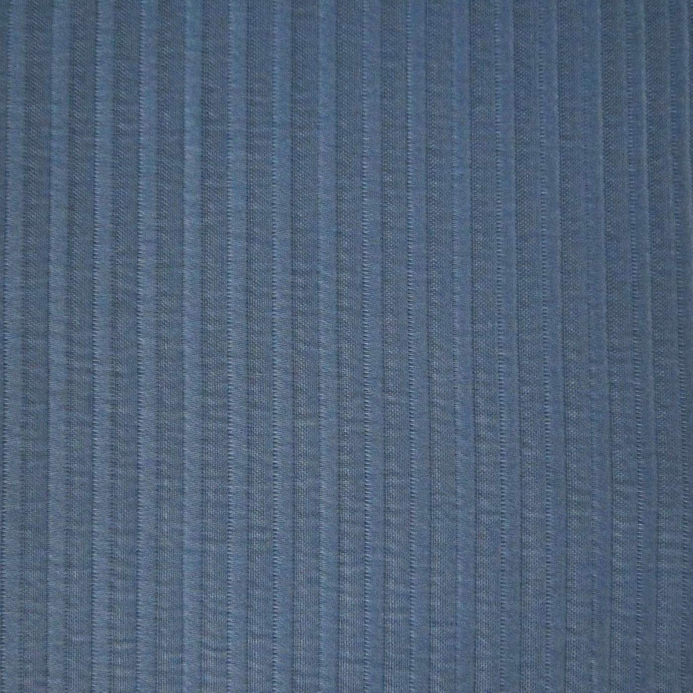 Close-up of Home Treasures Aristocrat coverlet showing slate blue woven stripe texture.