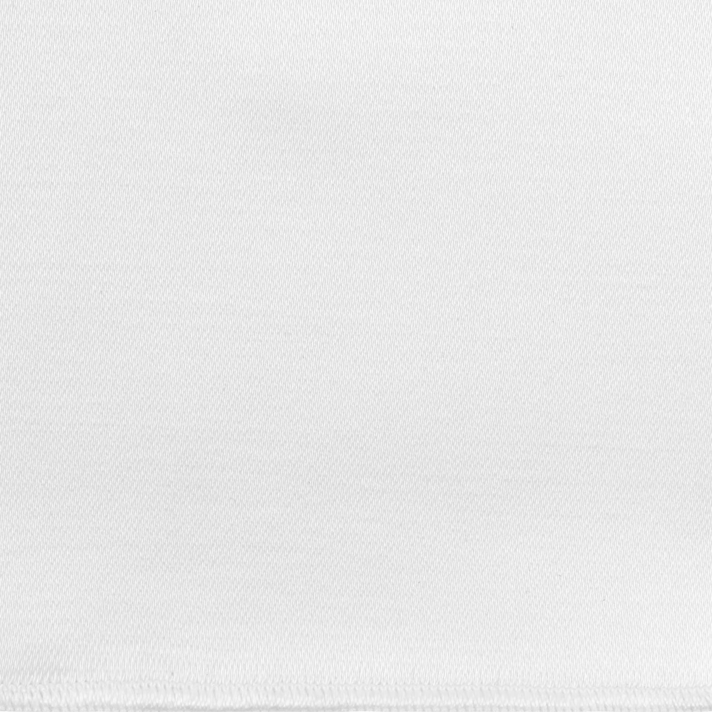 Close-up of white woven fabric texture showing fine diagonal weave detail.