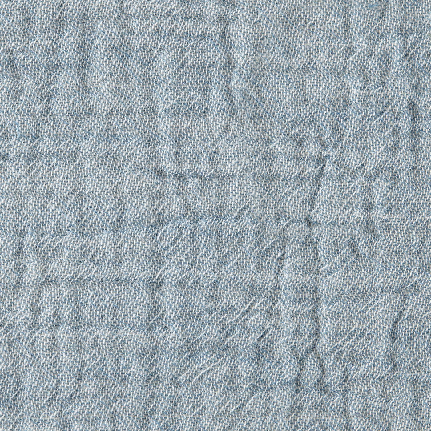 Close-up of Home Treasures Atacama linen fabric in dusty blue with subtle texture.