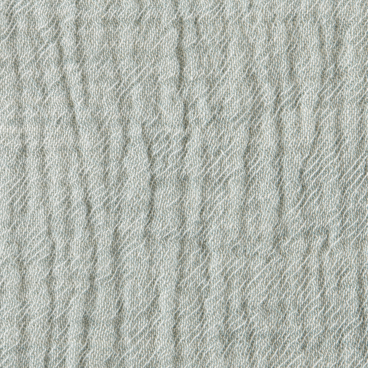 Close-up of Home Treasures Atacama fabric in sage, showing textured woven weave detail.