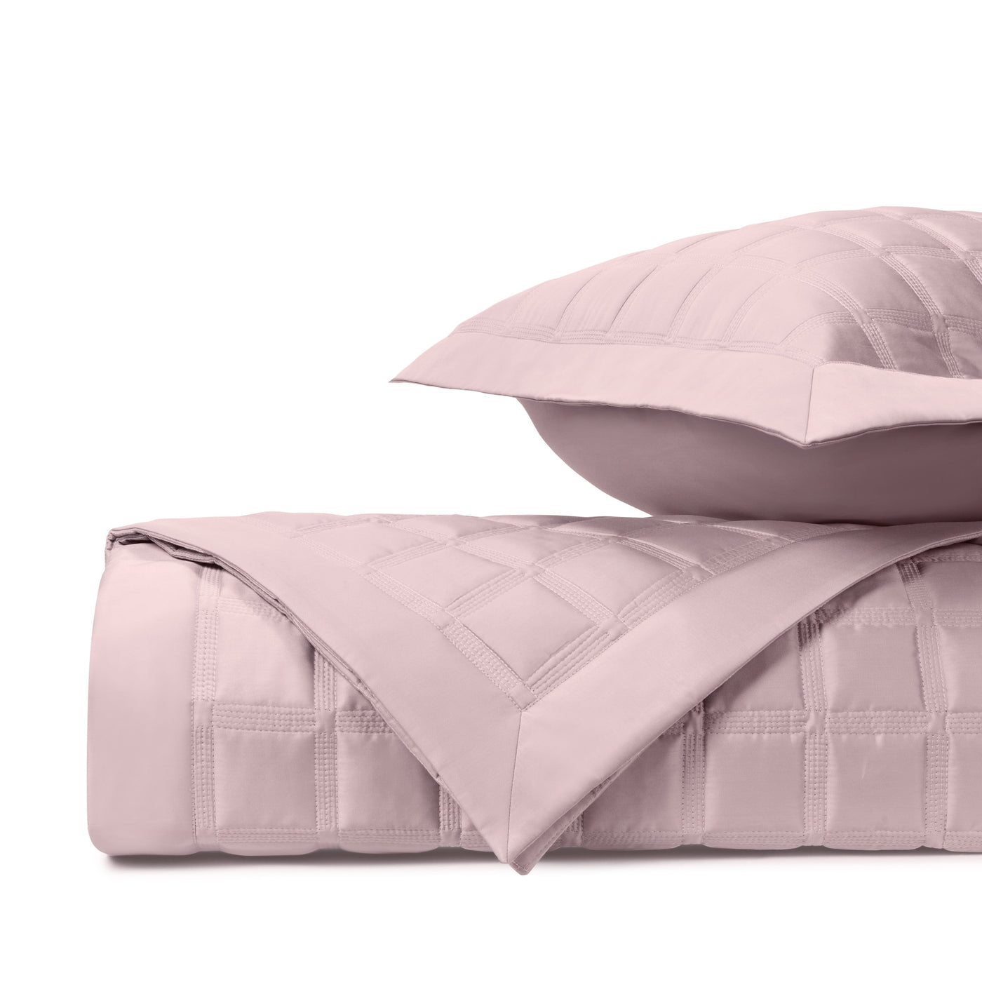 Close-up of Athens quilted cotton in blush, showing square quilting pattern and fabric texture.