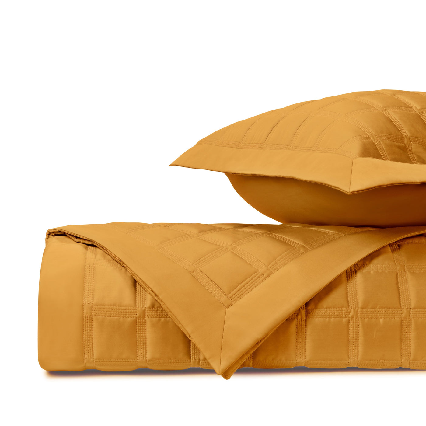 Close-up of Athens quilted satin in gold, showing box-stitch pattern and folded edge detail.