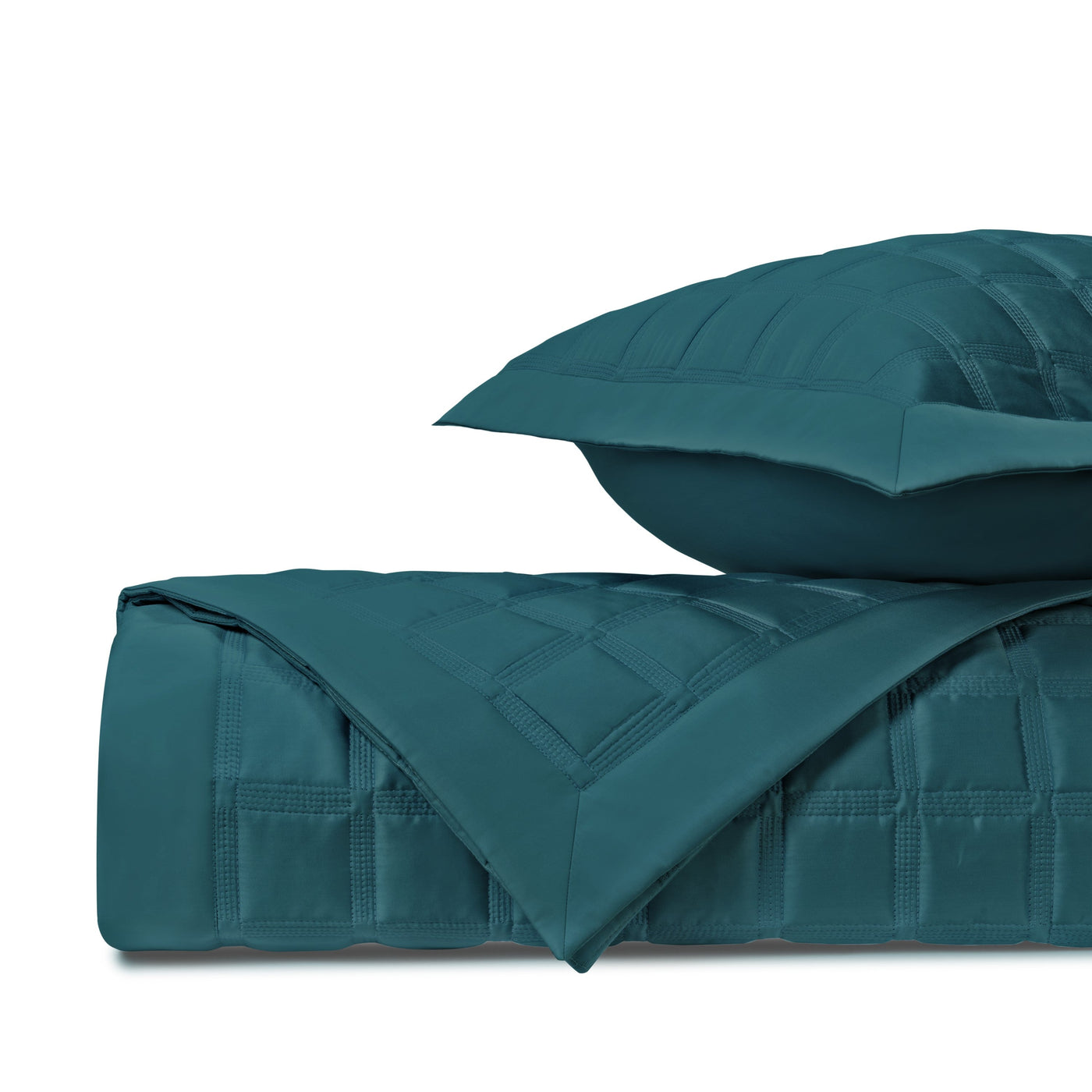 Close-up of Athens quilted satin in teal, showing grid-stitched texture and sheen.