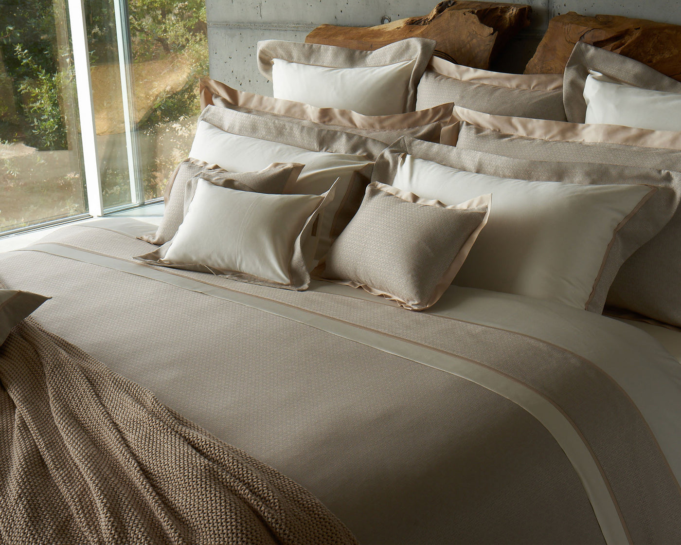 Celso de Lemos Avalon ivory and champagne linen pillowcase on styled bed.