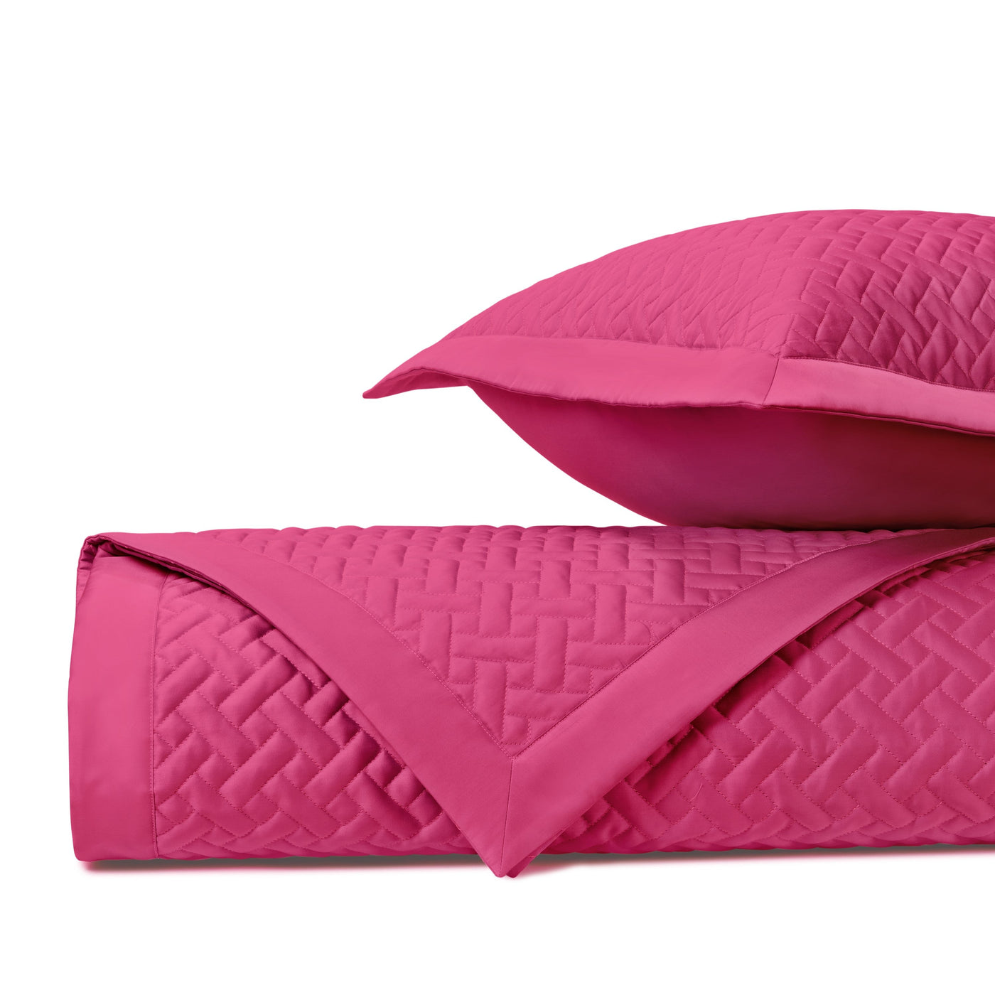 Basketweave quilted texture close-up in fuchsia, shown with coordinating sham.