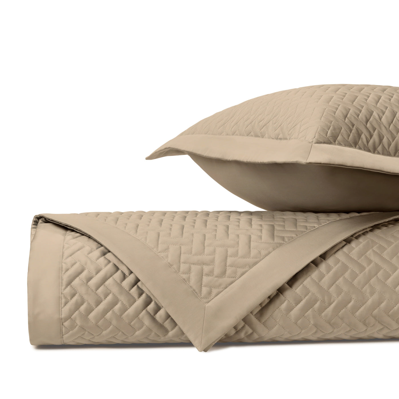 Close-up of Home Treasures Basketweave quilted texture in khaki, rolled with coordinating sham.