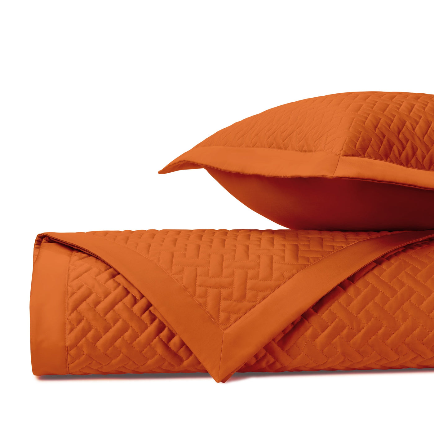 Close-up of Home Treasures Basketweave quilted texture in clementine orange.