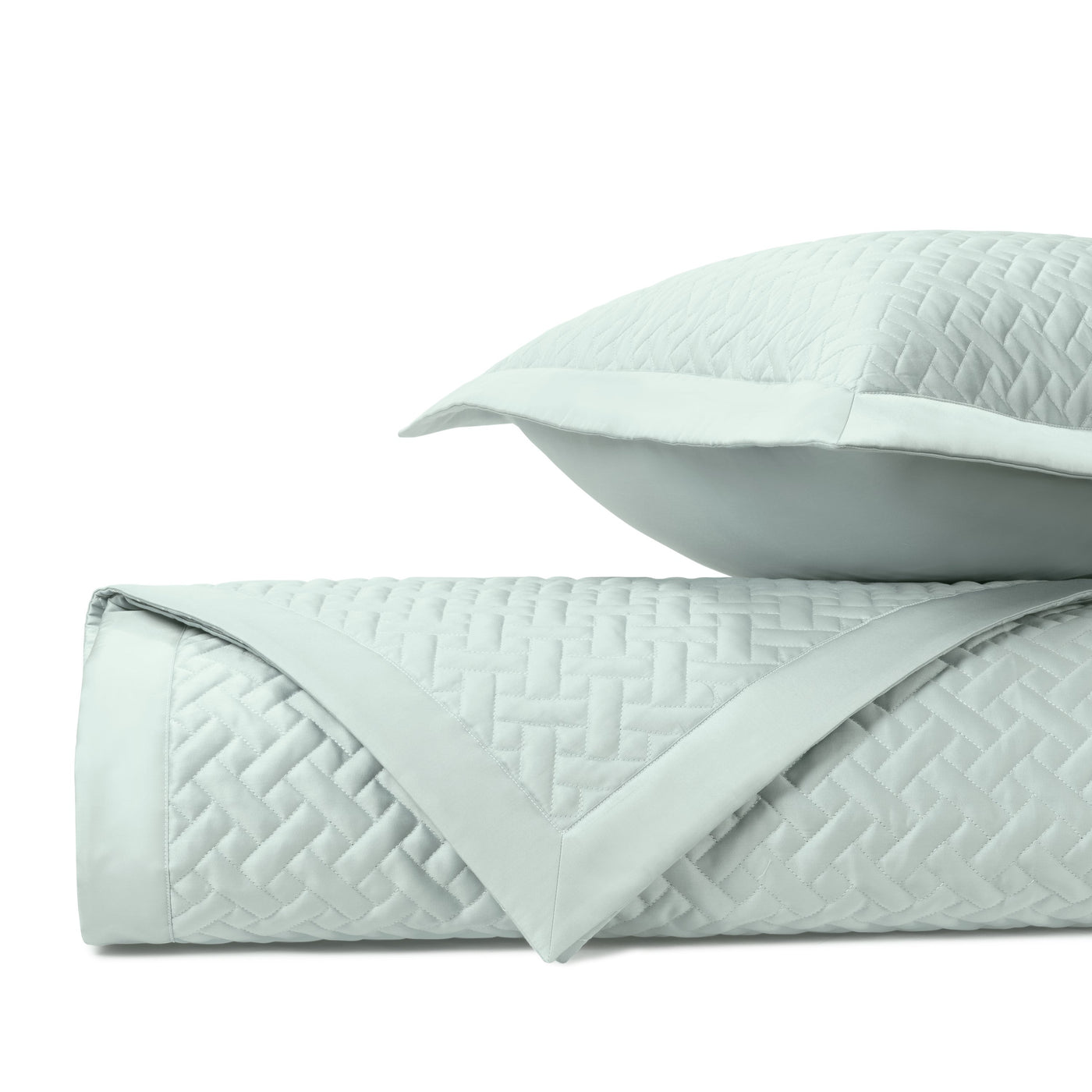 Close-up of quilted basketweave texture in mist blue with coordinating sham.