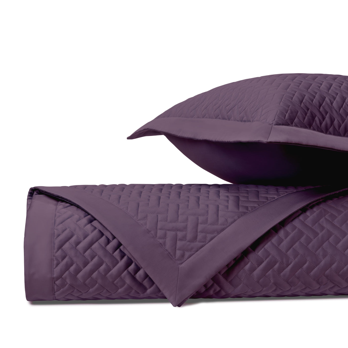Close-up of Home Treasures Basketweave quilted texture in deep plum with coordinating sham.