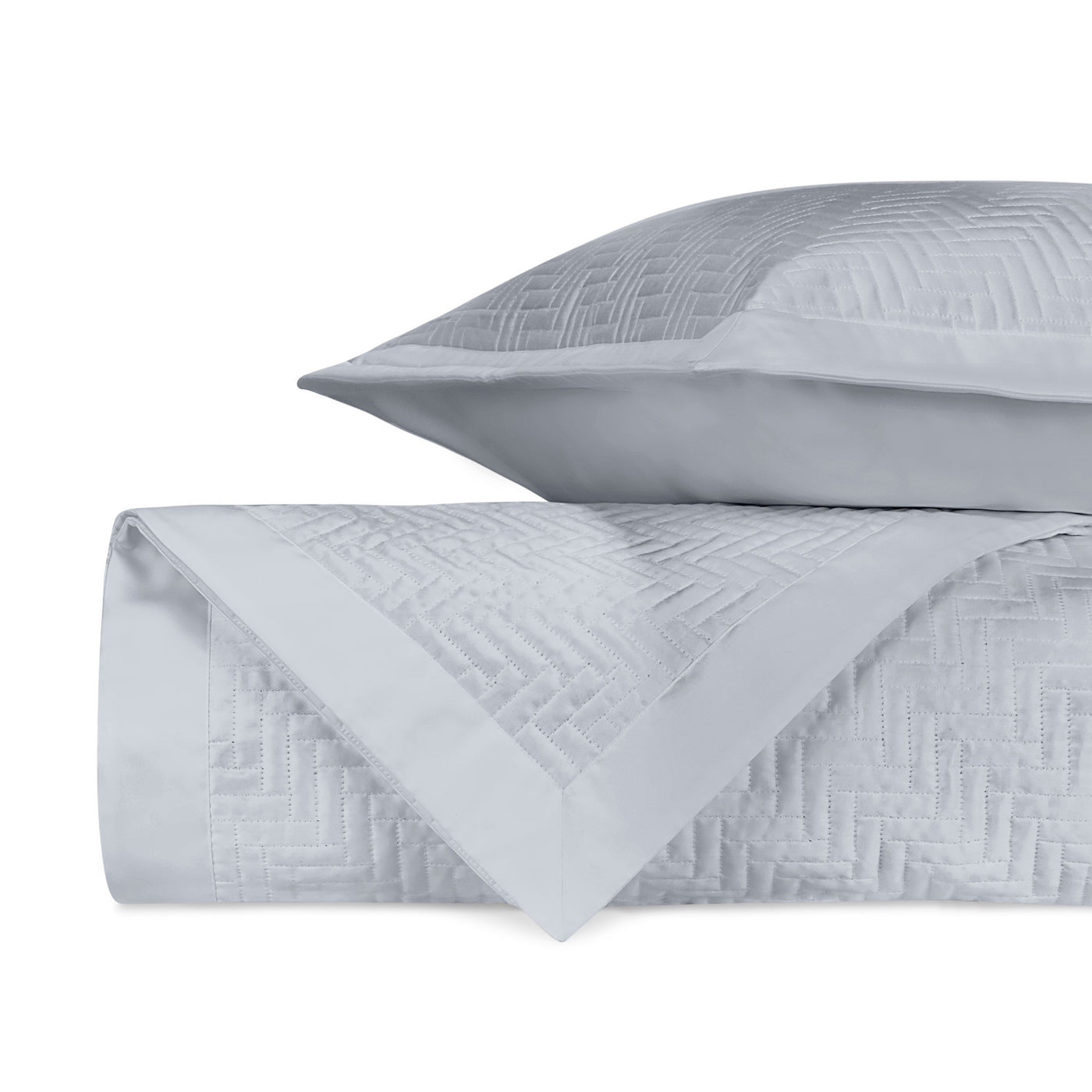 Baxter quilted cotton coverlet and sham in silver, showing geometric basketweave pattern.