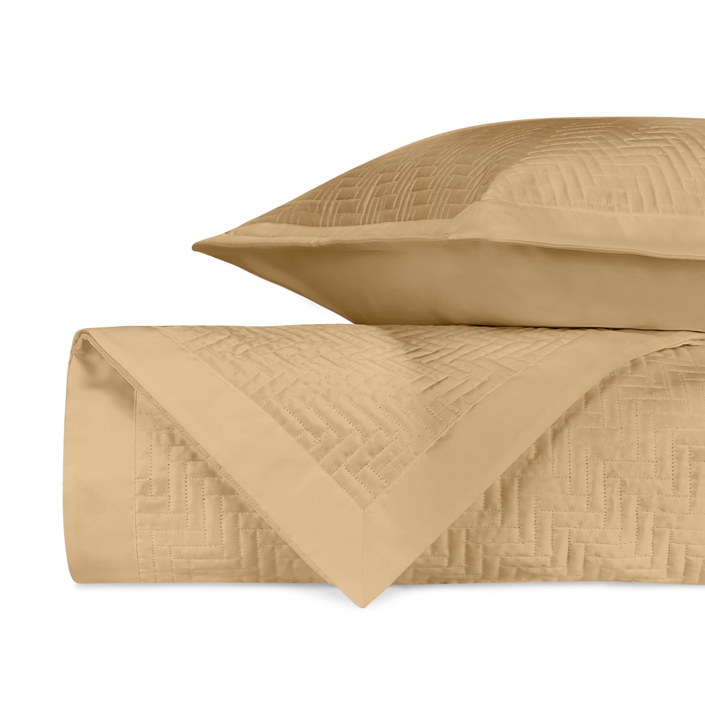 Close-up of Baxter quilted weave texture in honey gold cotton.