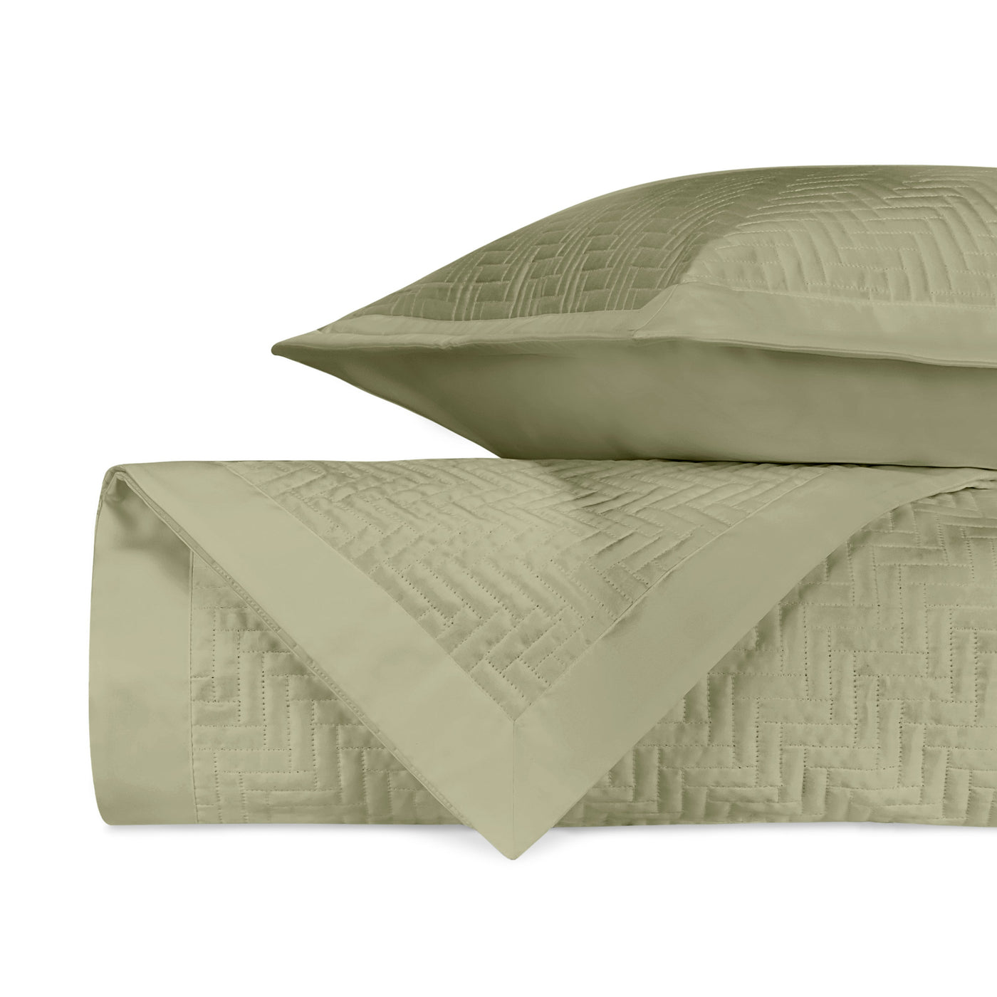 Sage quilted herringbone texture detail on folded coverlet and sham.