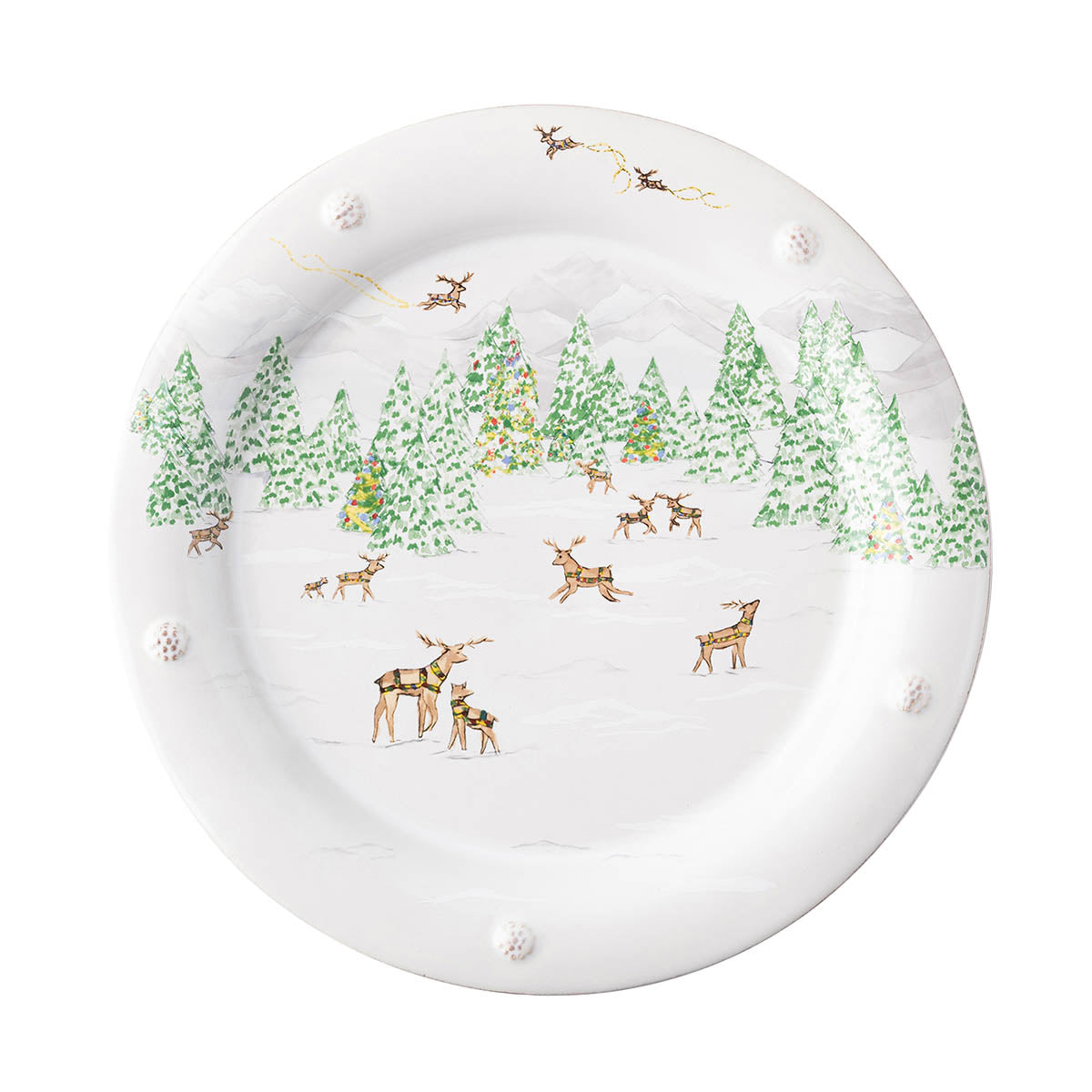 Juliska Berry & Thread North Pole dinner plate painted with a snowy evergreen forest and grazing reindeer inside a berry rim