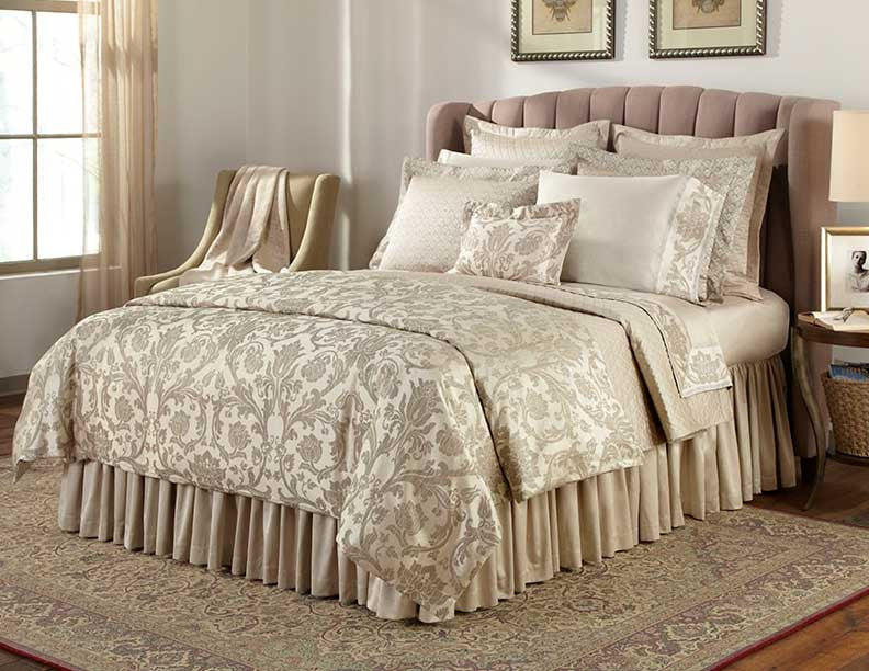 Champagne damask pattern on Anastasia bedding, styled on a fully dressed bed.