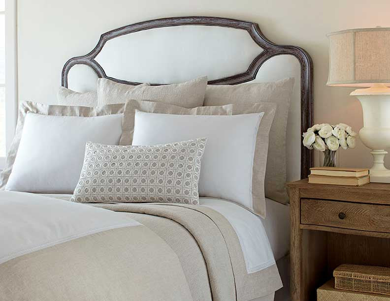 Close-up of Home Treasures Linea linen bedding in white and natural tones.