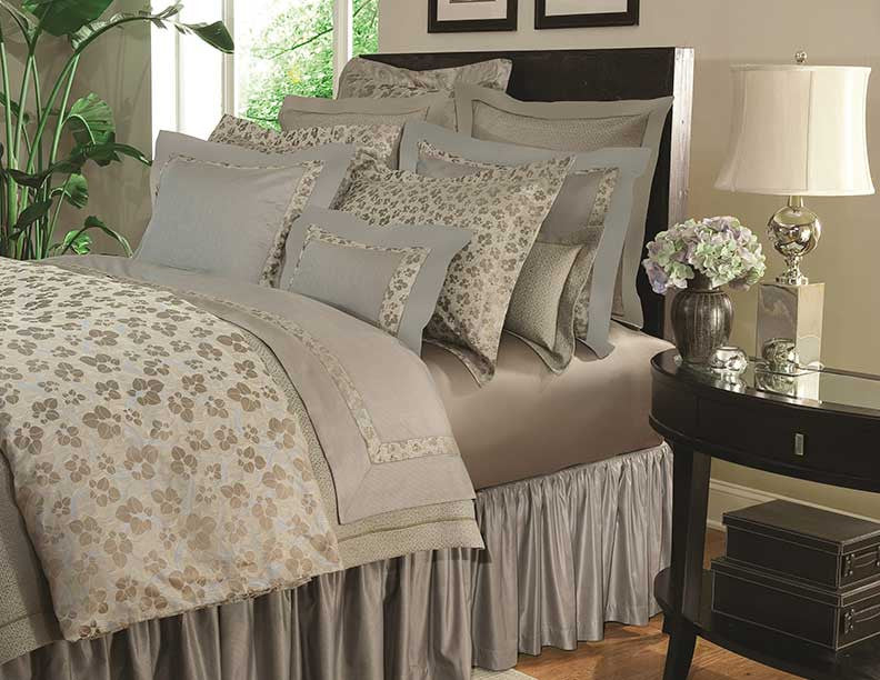 Home Treasures Valentene bedding in sage and champagne floral layered bed styling.
