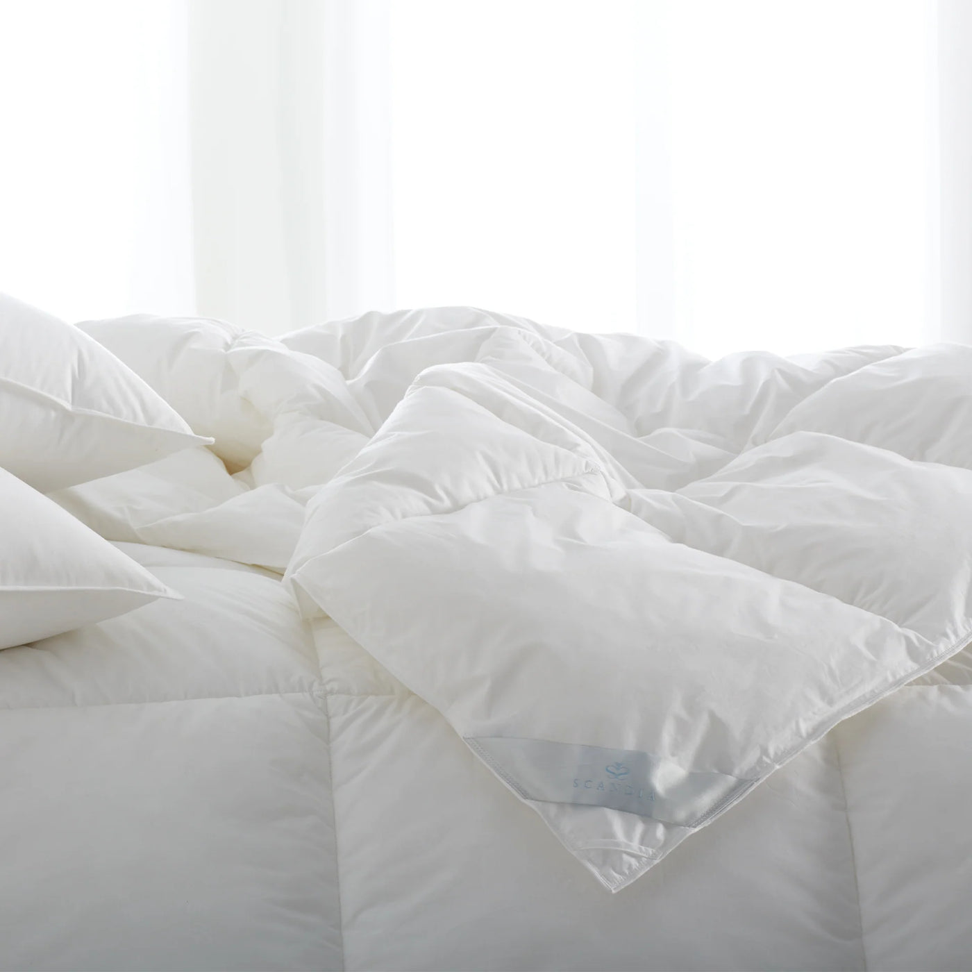 Close-up of white Scandia Home Bergen duvet, showing baffle-box construction and lofted fill.
