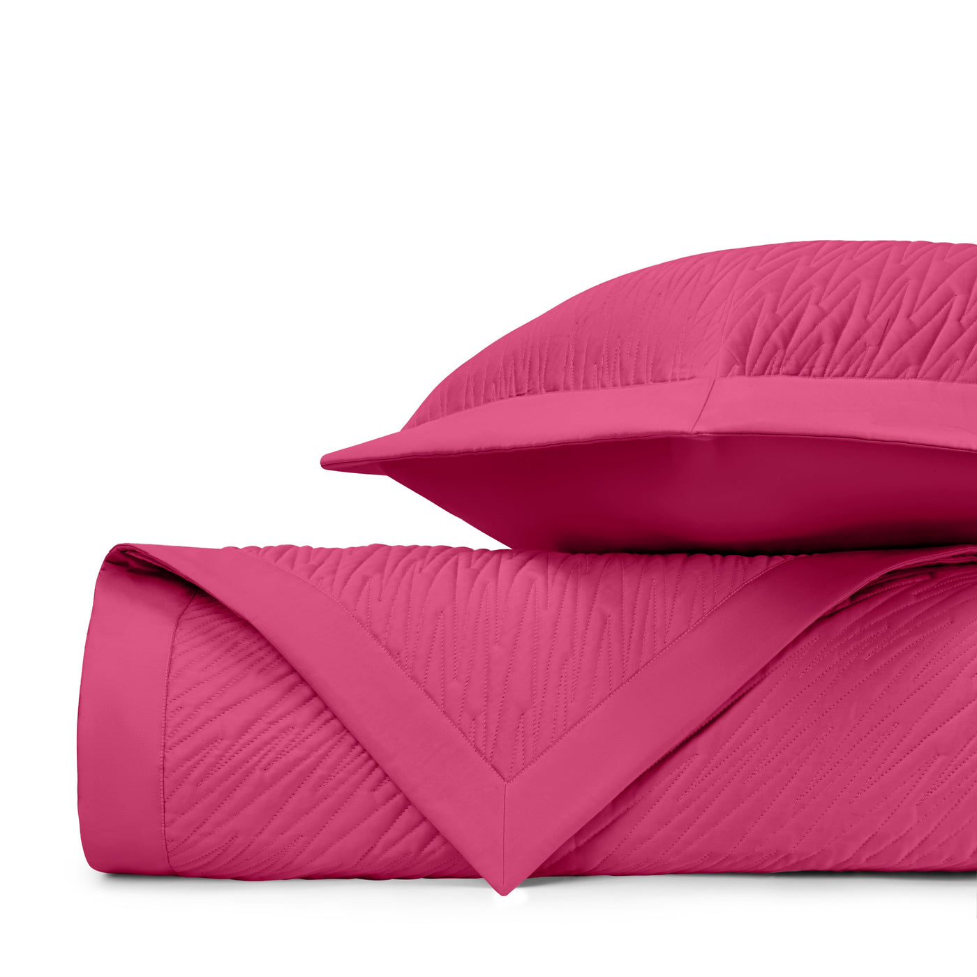 Close-up of Home Treasures Blaze quilted texture in fuchsia with chevron stitching detail.