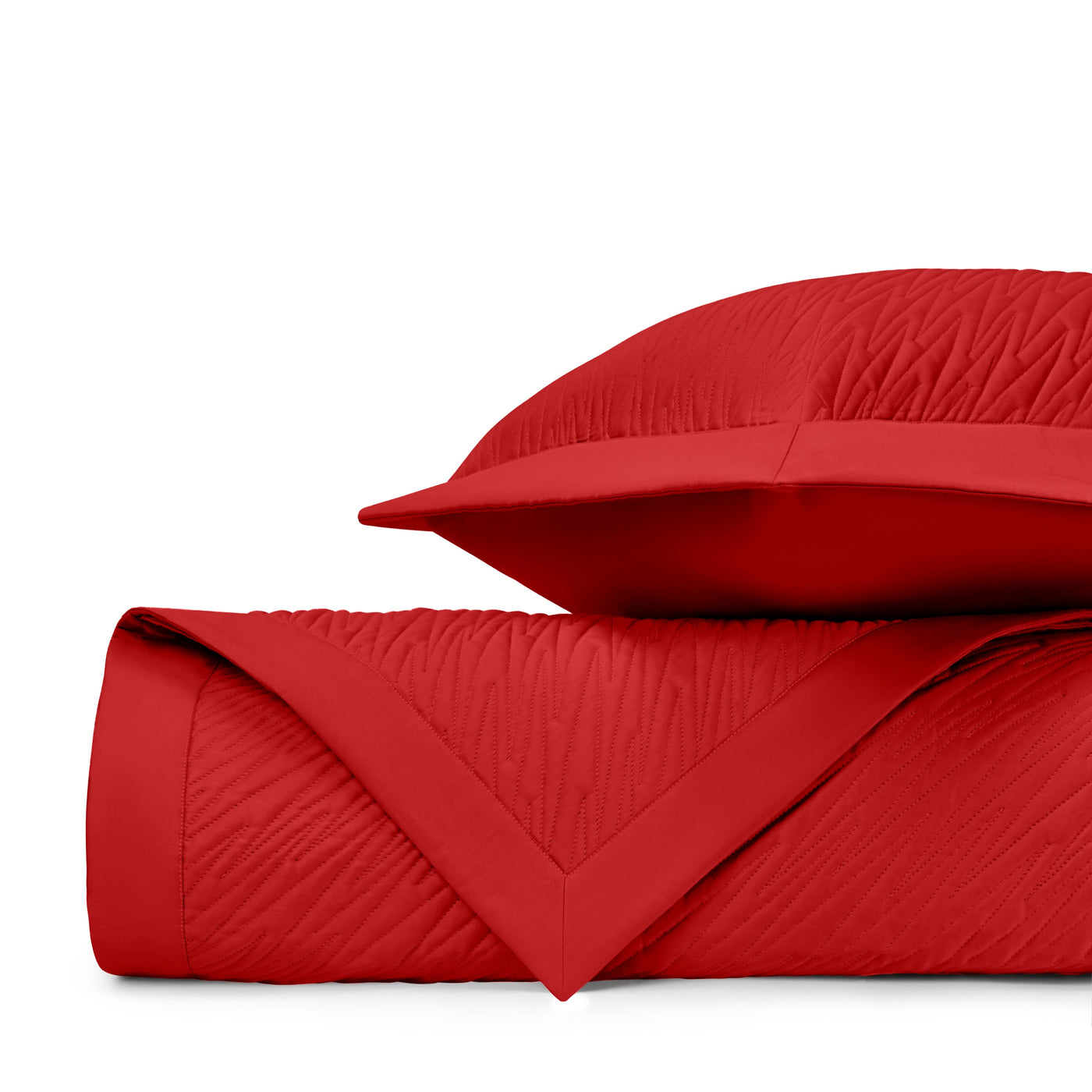 Close-up of crimson quilted texture on Home Treasures Blaze coverlet and sham.