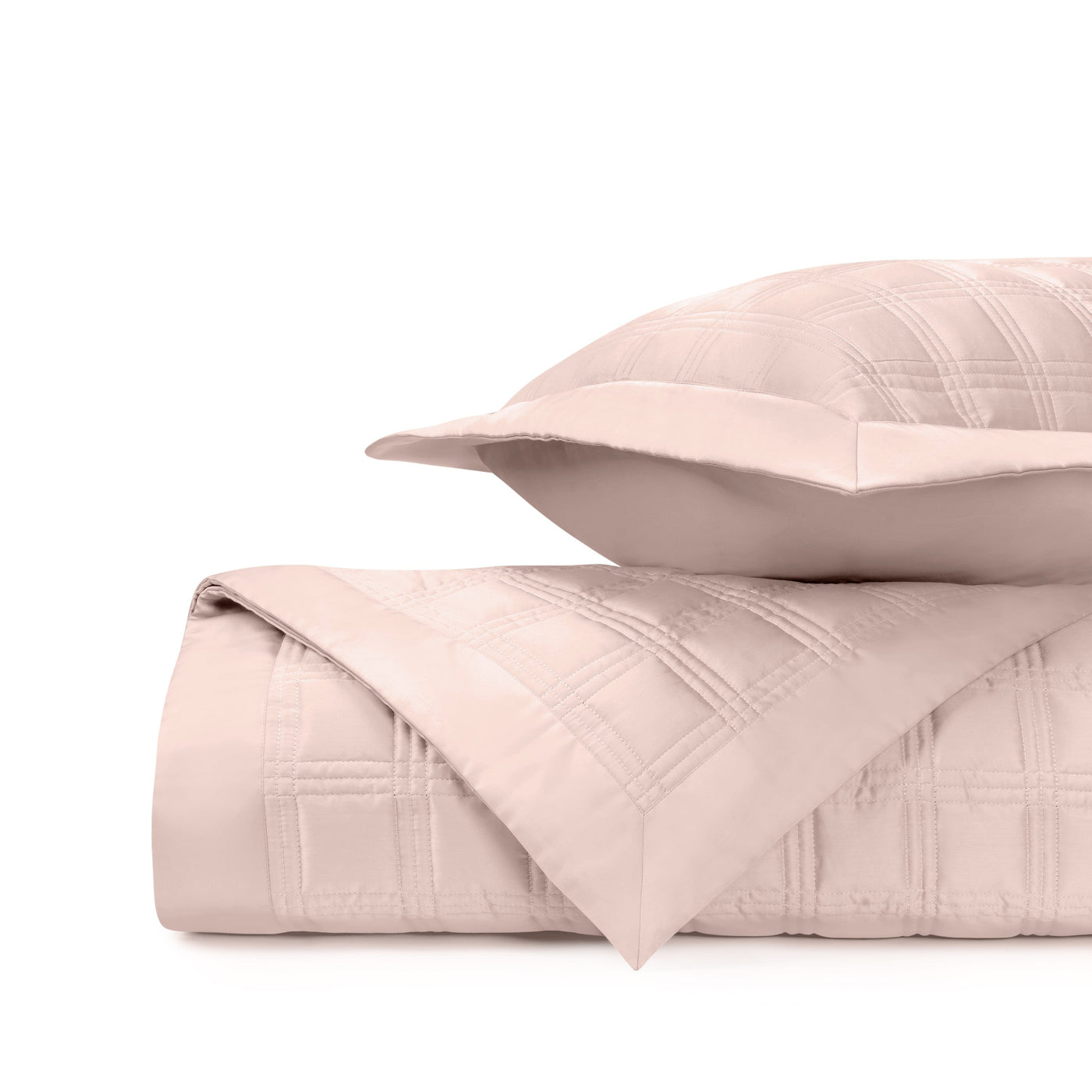 Close-up of Home Treasures Block quilted cotton in blush pink with geometric square pattern.