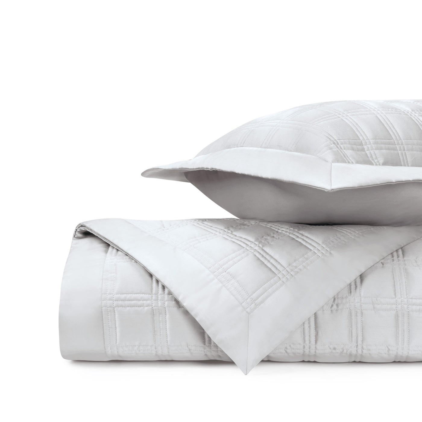 Close-up of Home Treasures Block quilted white cotton with tonal plaid stitching detail.