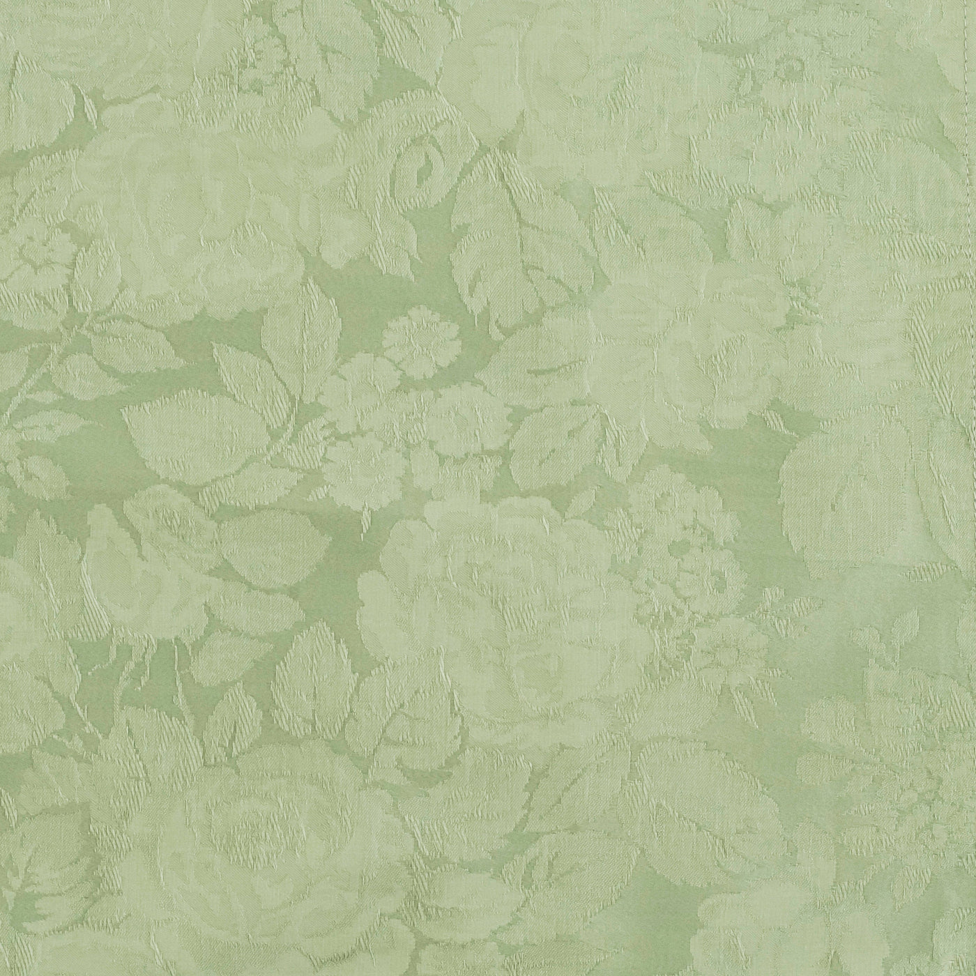 Close-up of sage green damask fabric with tone-on-tone woven floral and leaf pattern.