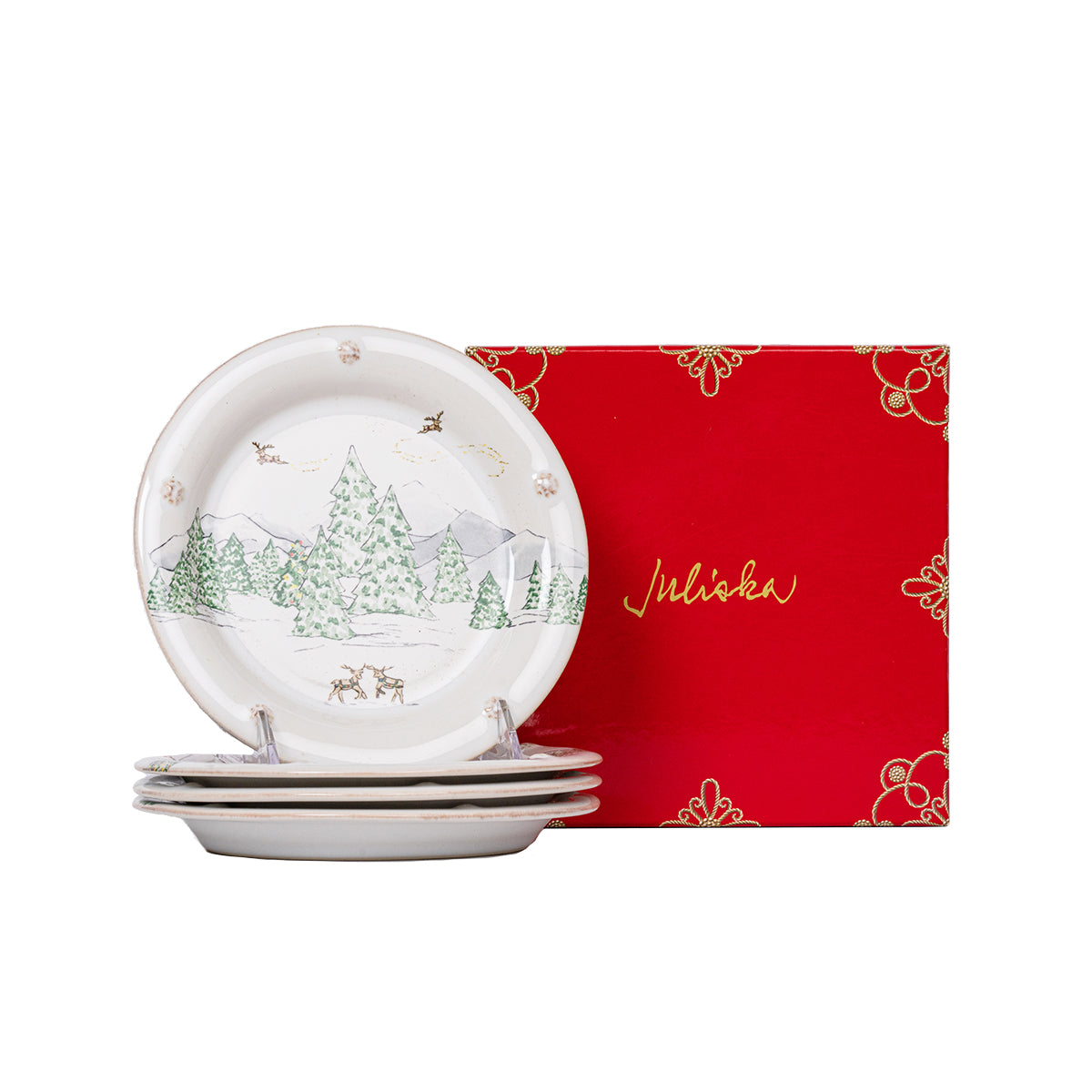 Stack of North Pole side plates beside a red Juliska gift box