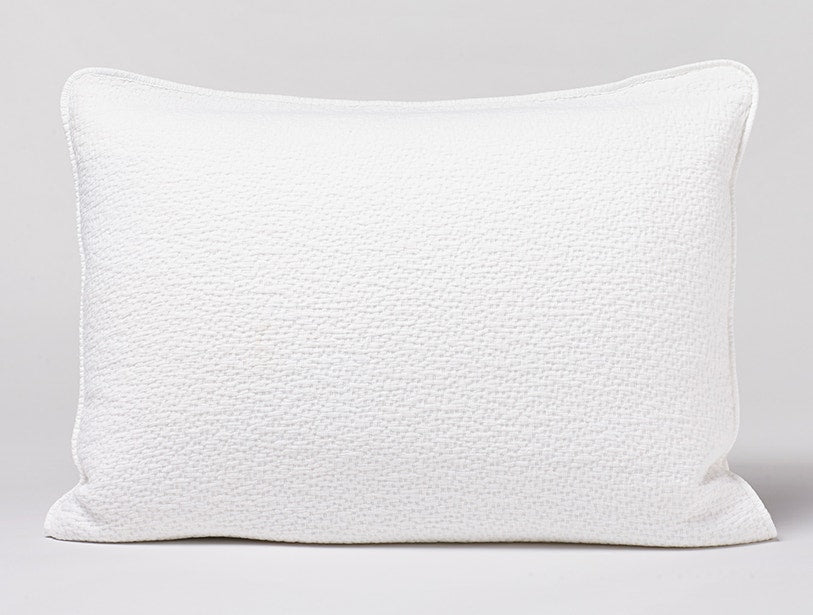Coyuchi Cascade Matelassé pillow sham in white with textured woven surface.