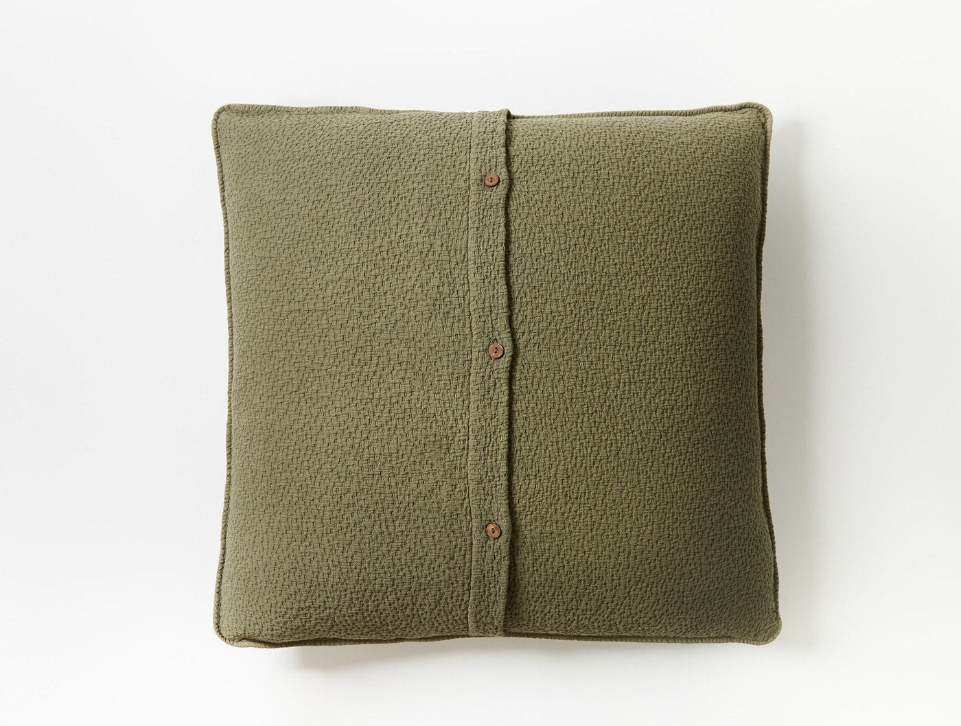 Back view of Coyuchi Cascade Matelassé sham in moss green with button closure.