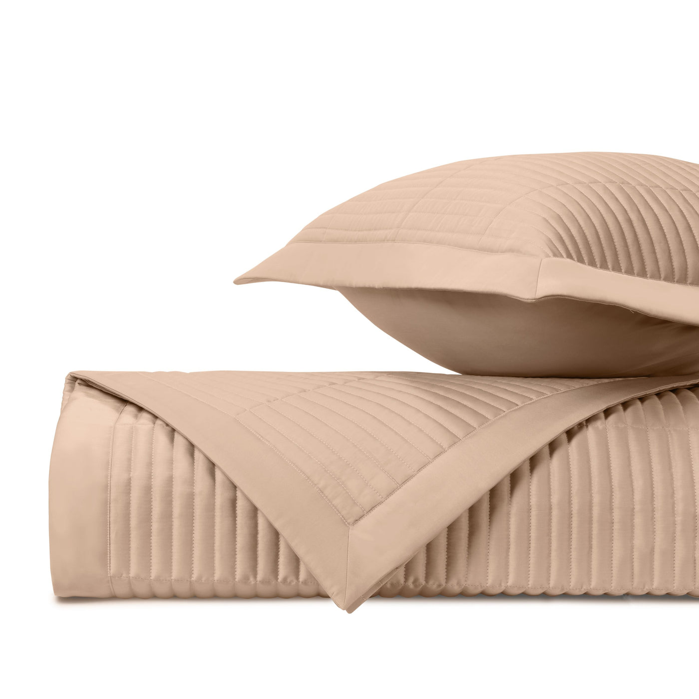 Close-up of Home Treasures Channel quilted texture in camel with parallel stitching detail.