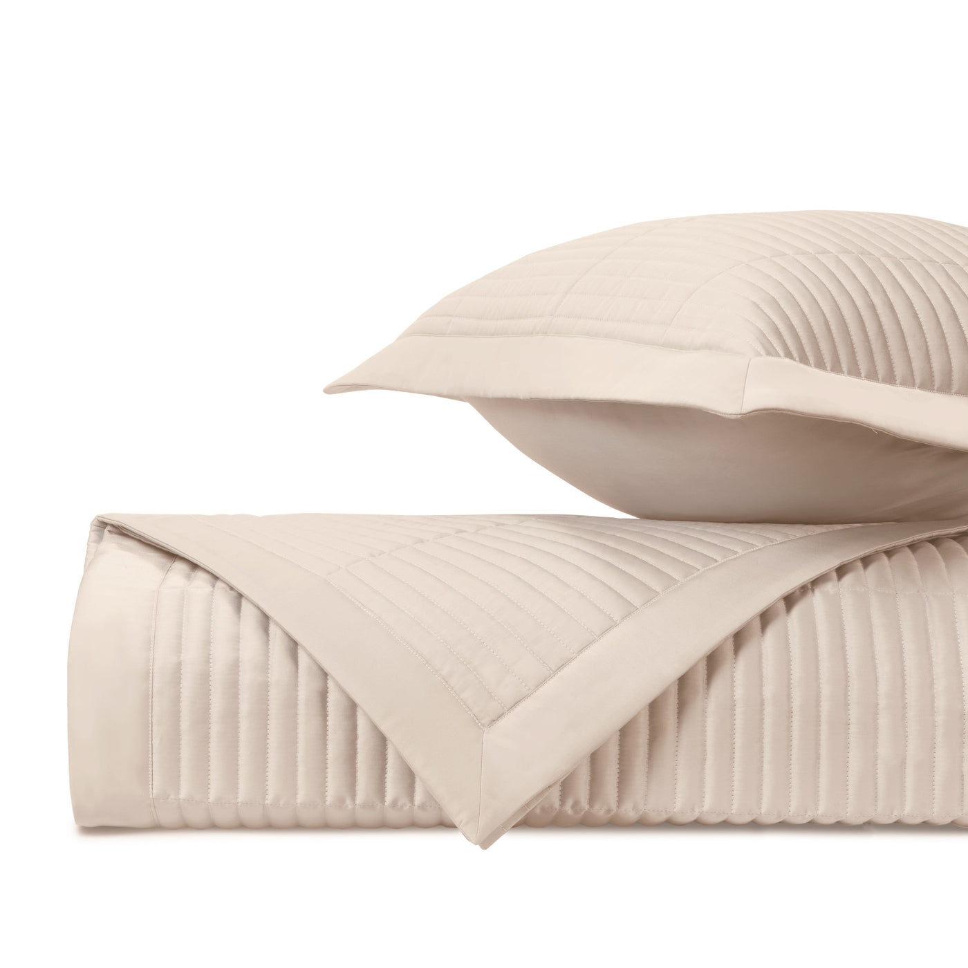 Close-up of Home Treasures Channel quilted texture in ivory with parallel channel stitching.