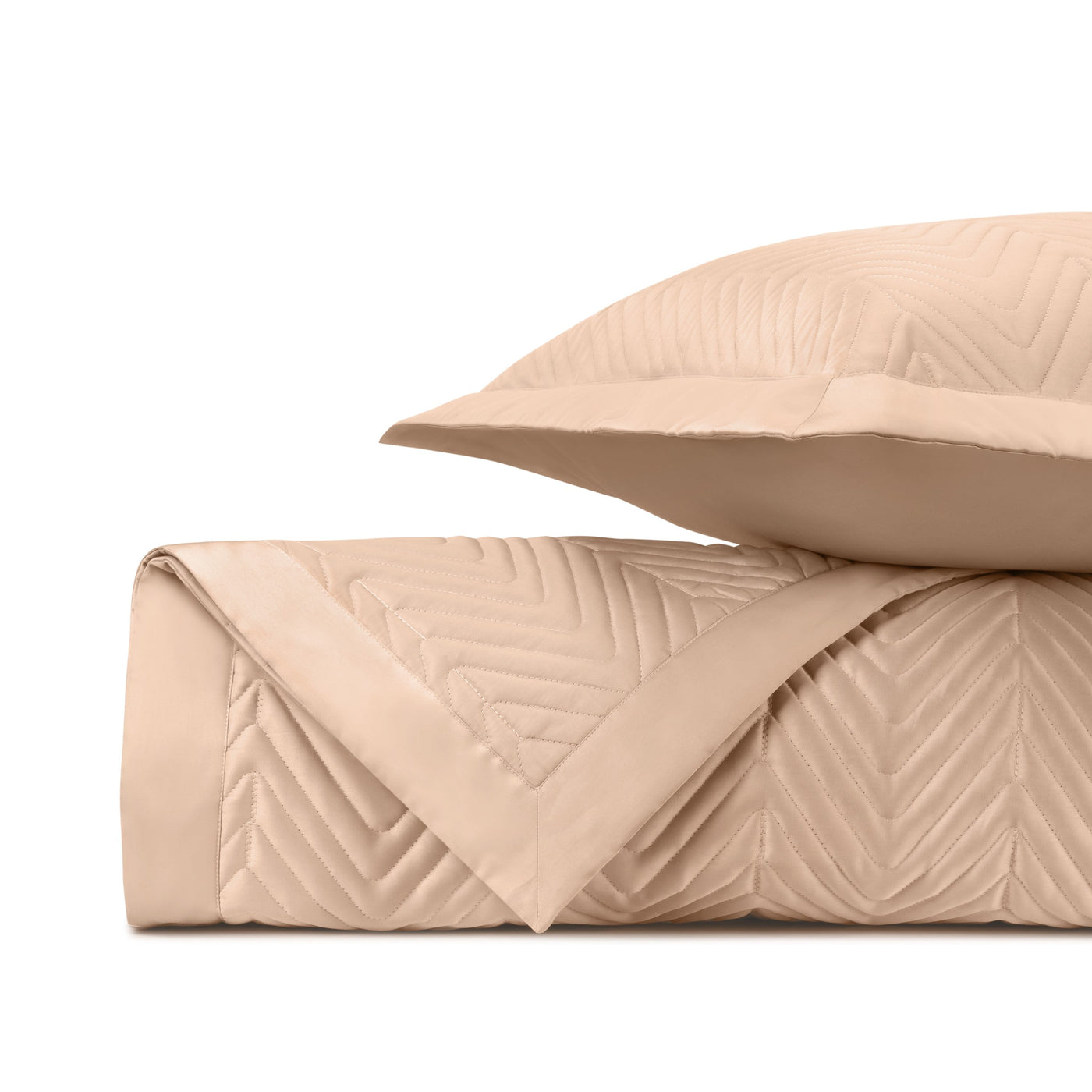 Close-up of Charleston quilted texture in blush, showing chevron stitching detail.