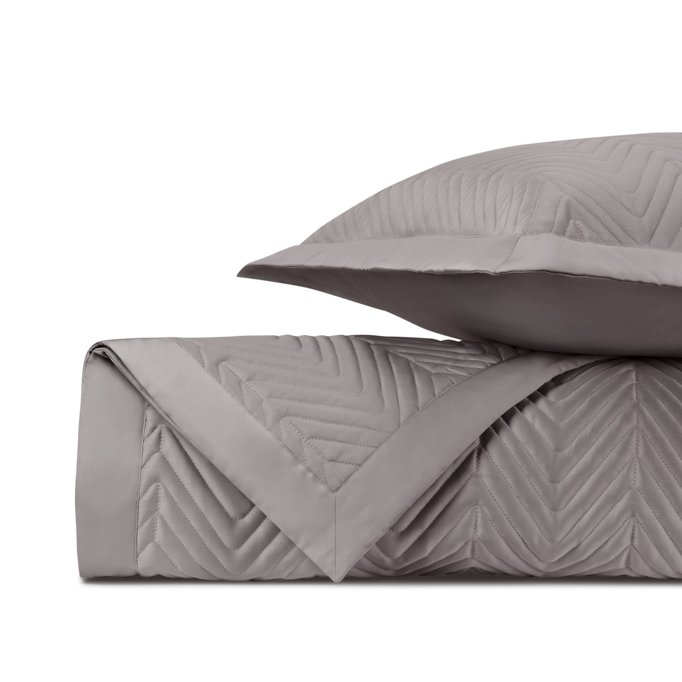 Close-up of Charleston quilted satin in mink, showing chevron stitching texture.
