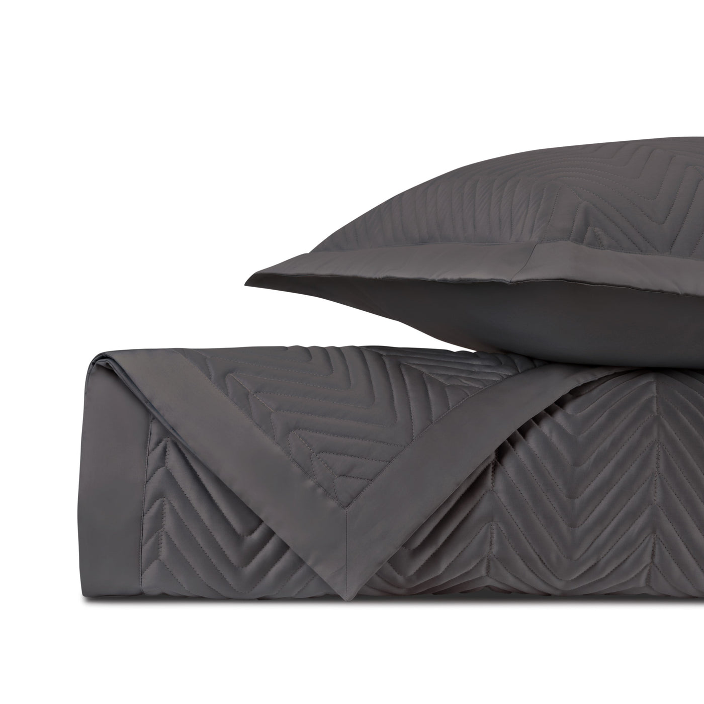 Charcoal quilted chevron stitching detail on folded coverlet with matching sham.