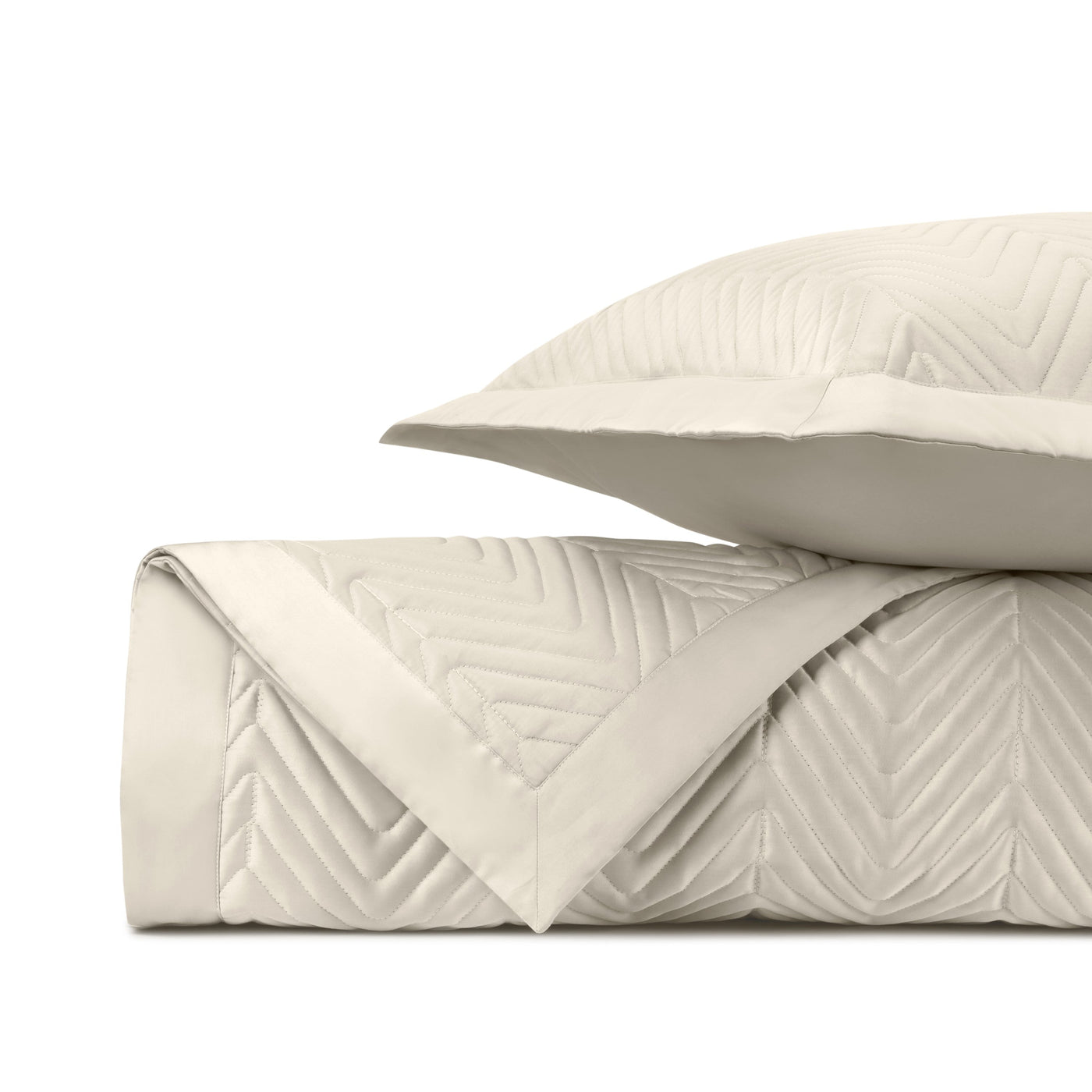Close-up of Home Treasures Charleston ivory quilted chevron pattern and texture detail.