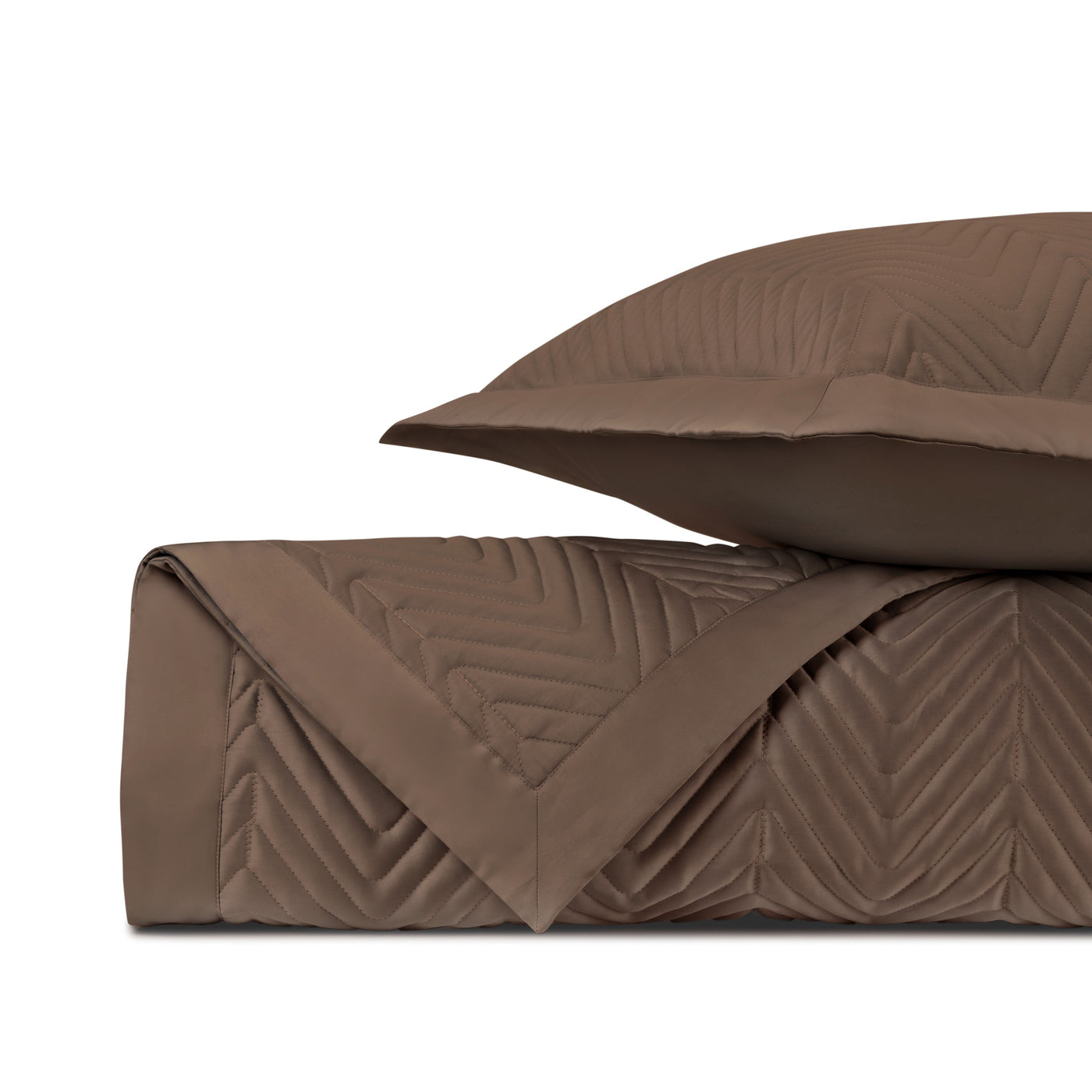 Chocolate quilted chevron texture detail on folded Charleston coverlet and sham.