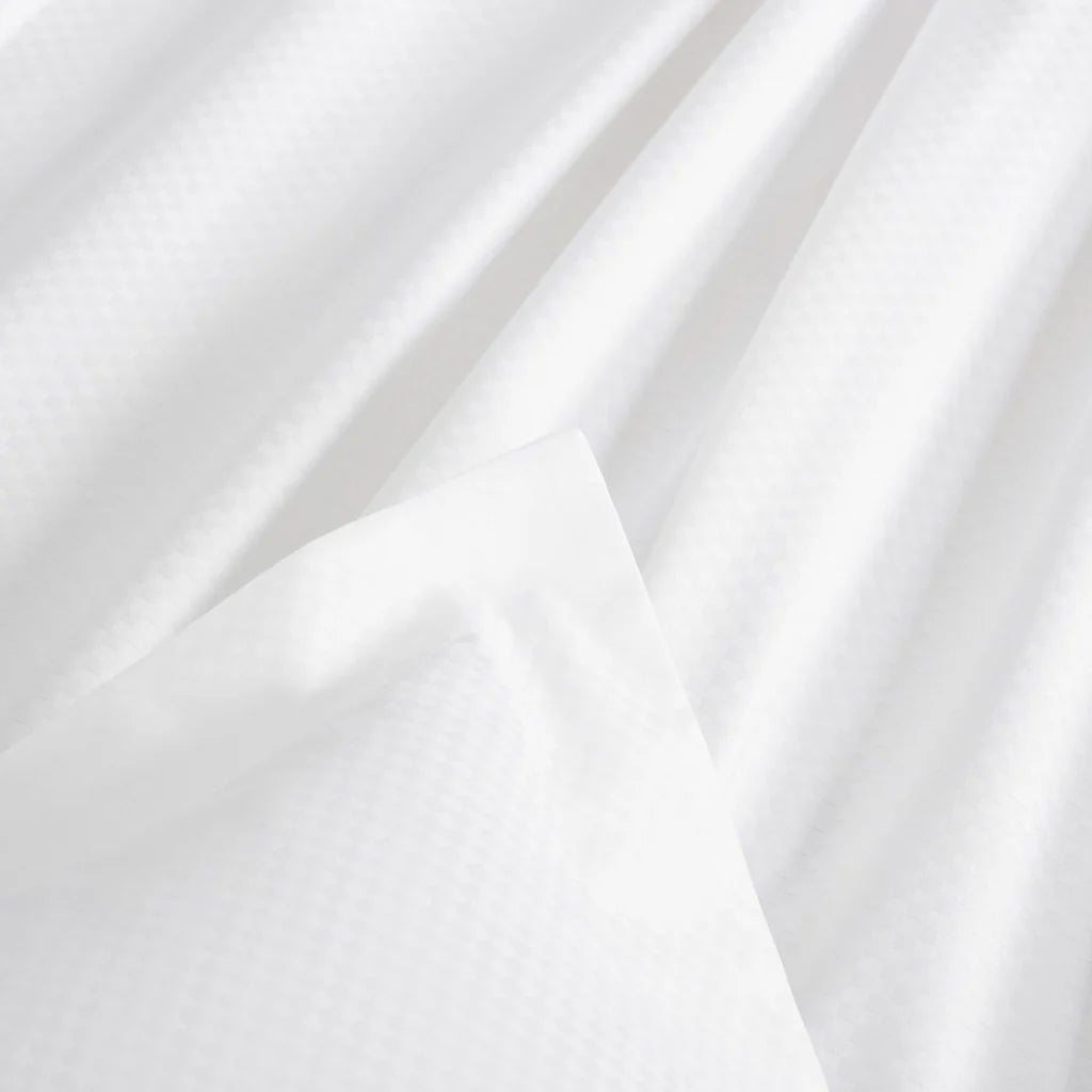 The Frette Checkered Sateen Pillow Sham Set features a subtle checkered pattern and smooth finish, bringing the refined elegance of a boutique hotel bed to your home.