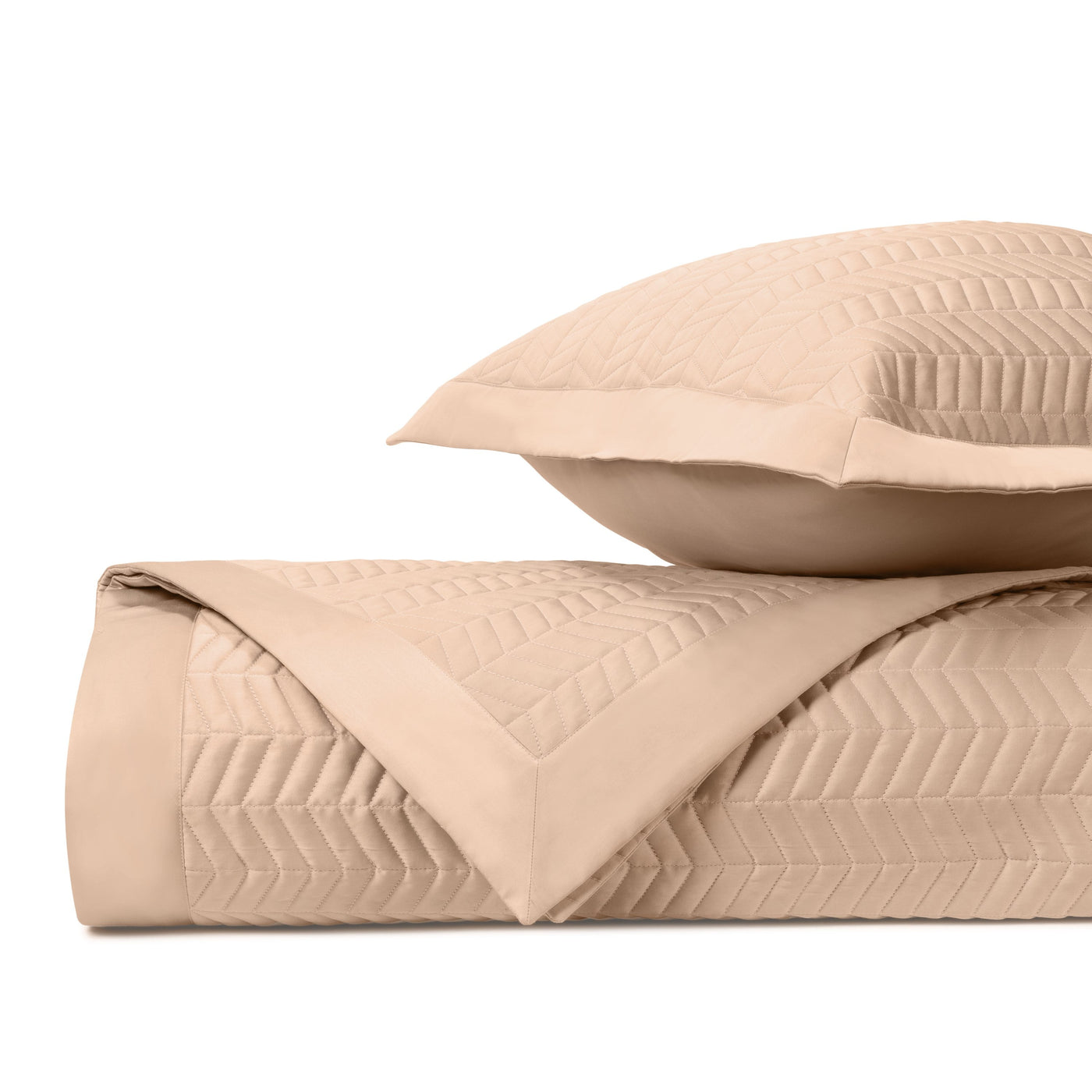 Closeup of Chester quilted texture in blush, showing chevron stitching pattern detail.