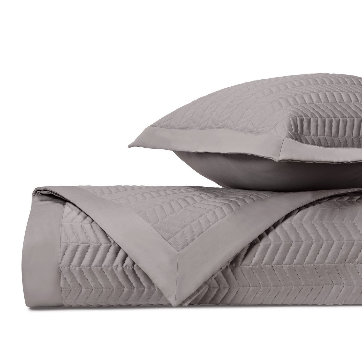 Close-up of Chester quilted satin in slate grey chevron stitch pattern.