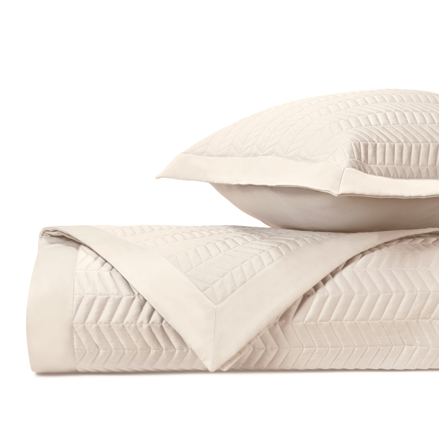 Close-up of ivory Chester quilted texture with herringbone stitching pattern and border detail.