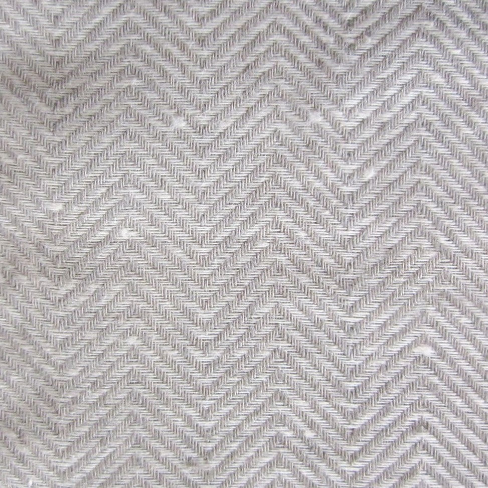 Close-up of Chester coverlet's silver and ivory herringbone weave texture.